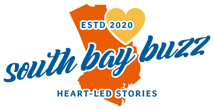 Outline of the south bay of los angeles in orange with a yellow heart in the corner with the words estd. 2020 south bay buzz heart-led stories on it