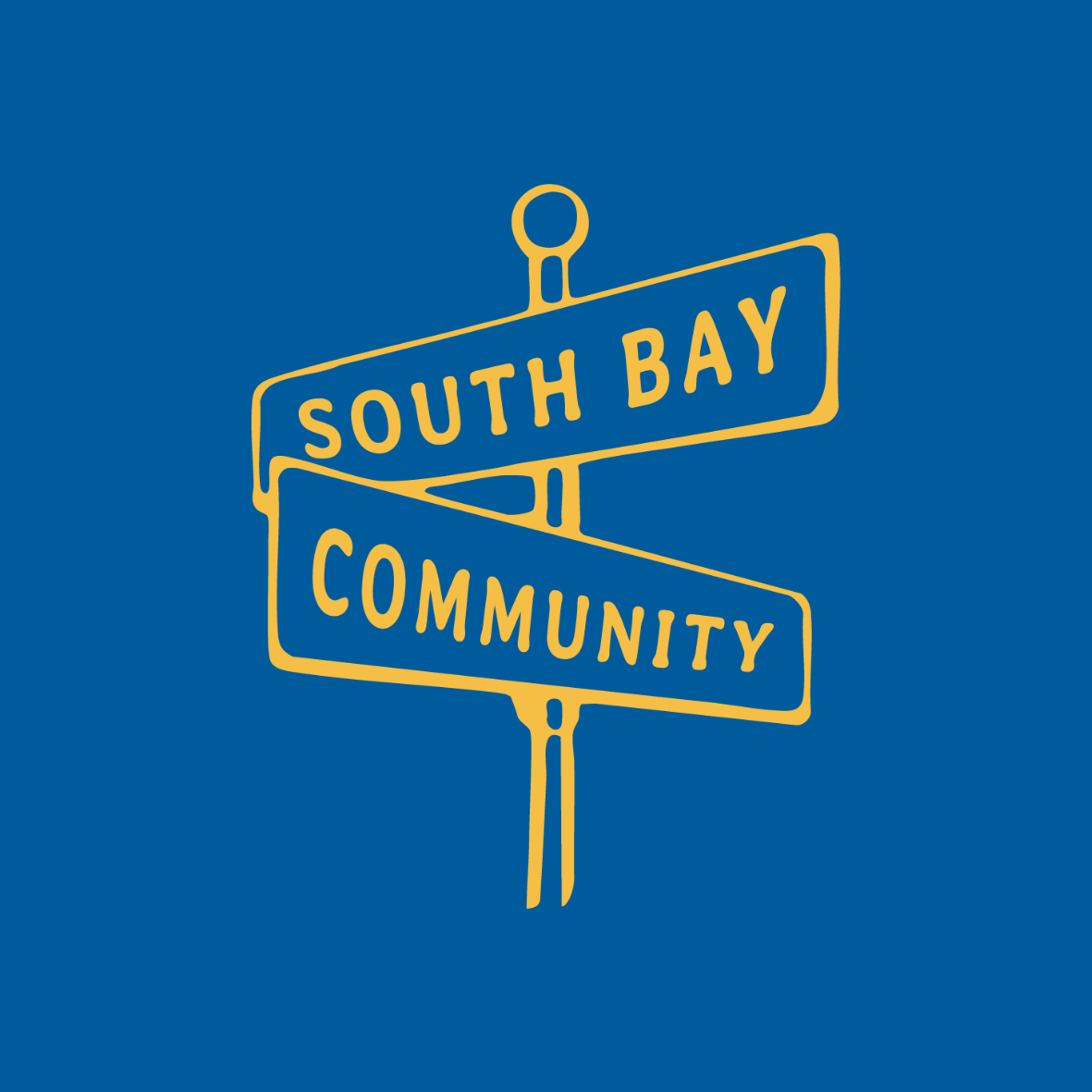 south bay community sign in yellow with blue background