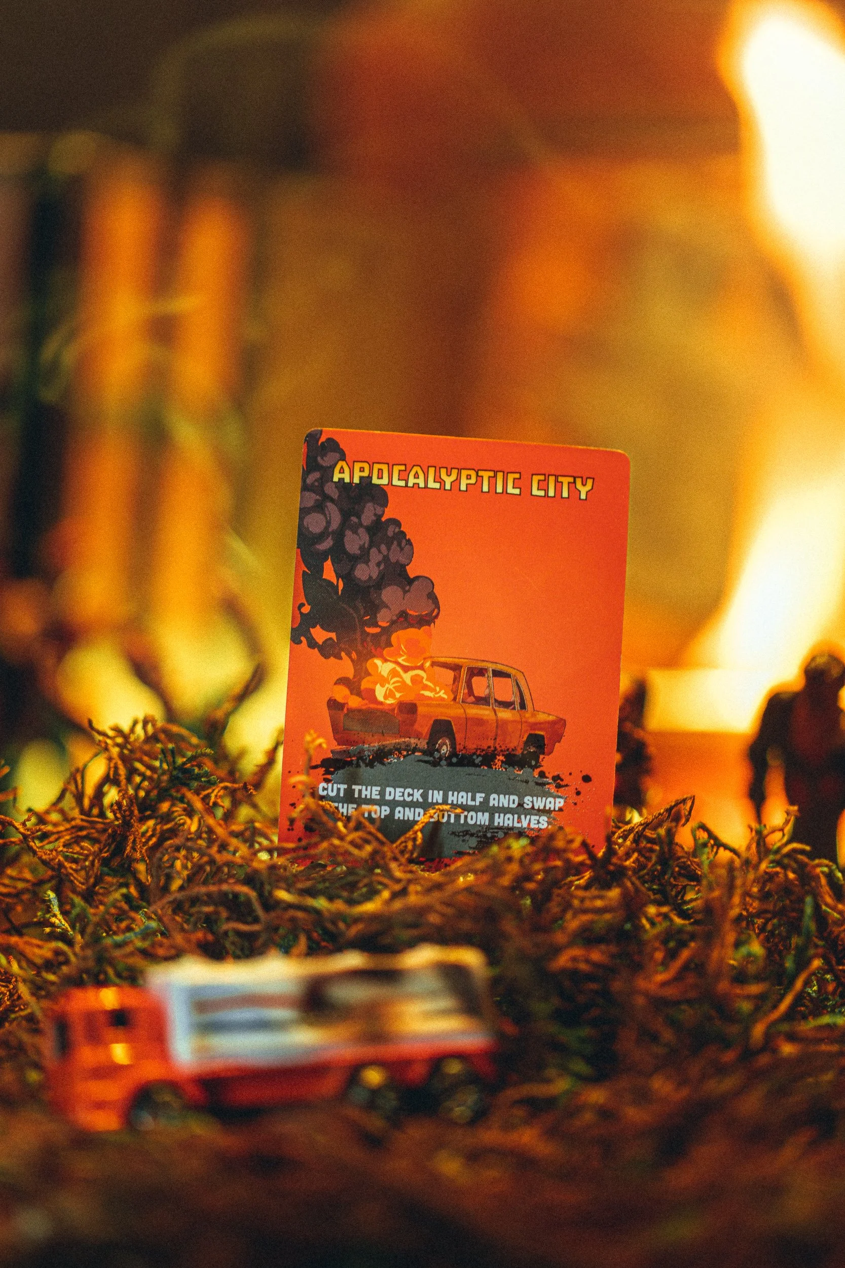 ZETA Survival Apocalyptic City card with miniature fire truck and flames, product photography by James Brasier