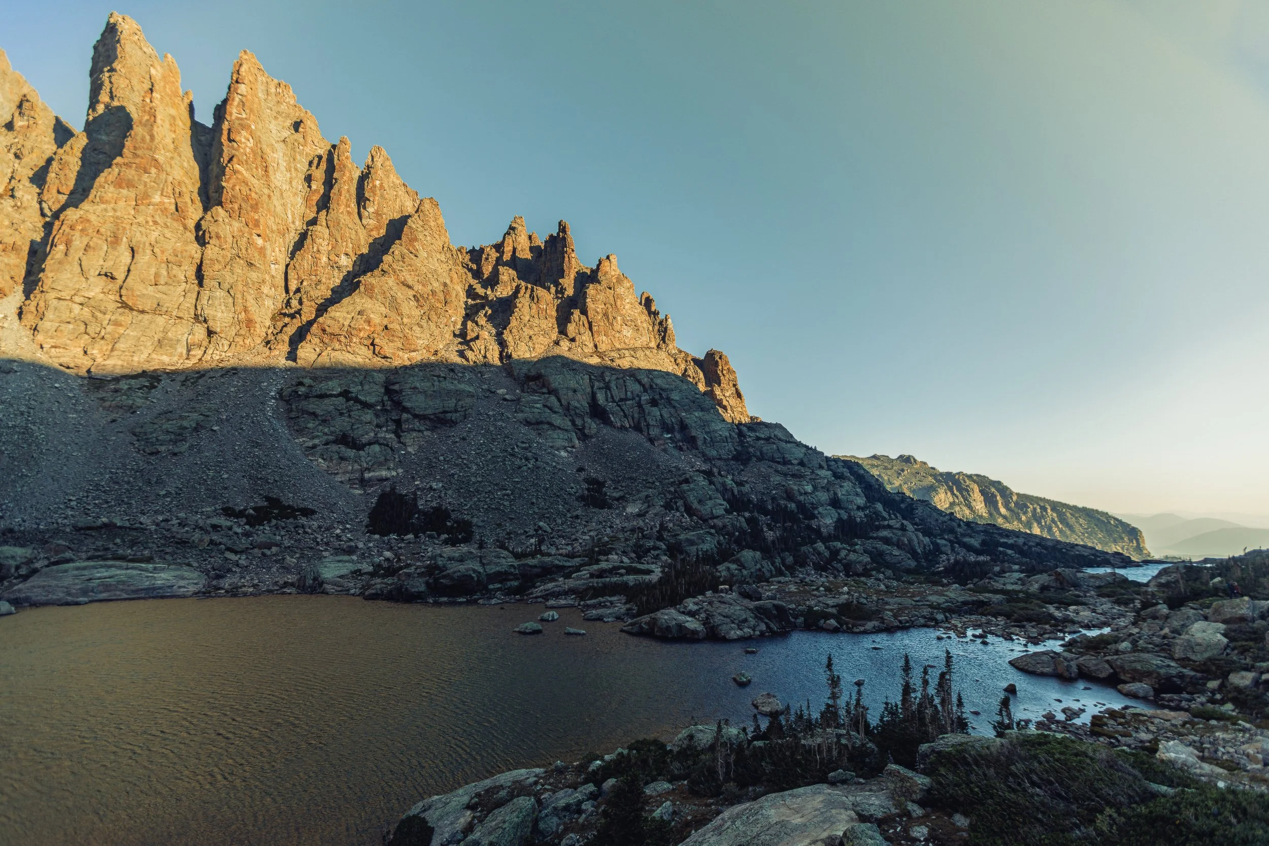 Golden light on granite spires above Sky Pond at Rocky Mountain National Park, Colorado alpine landscape photography by James Brasier