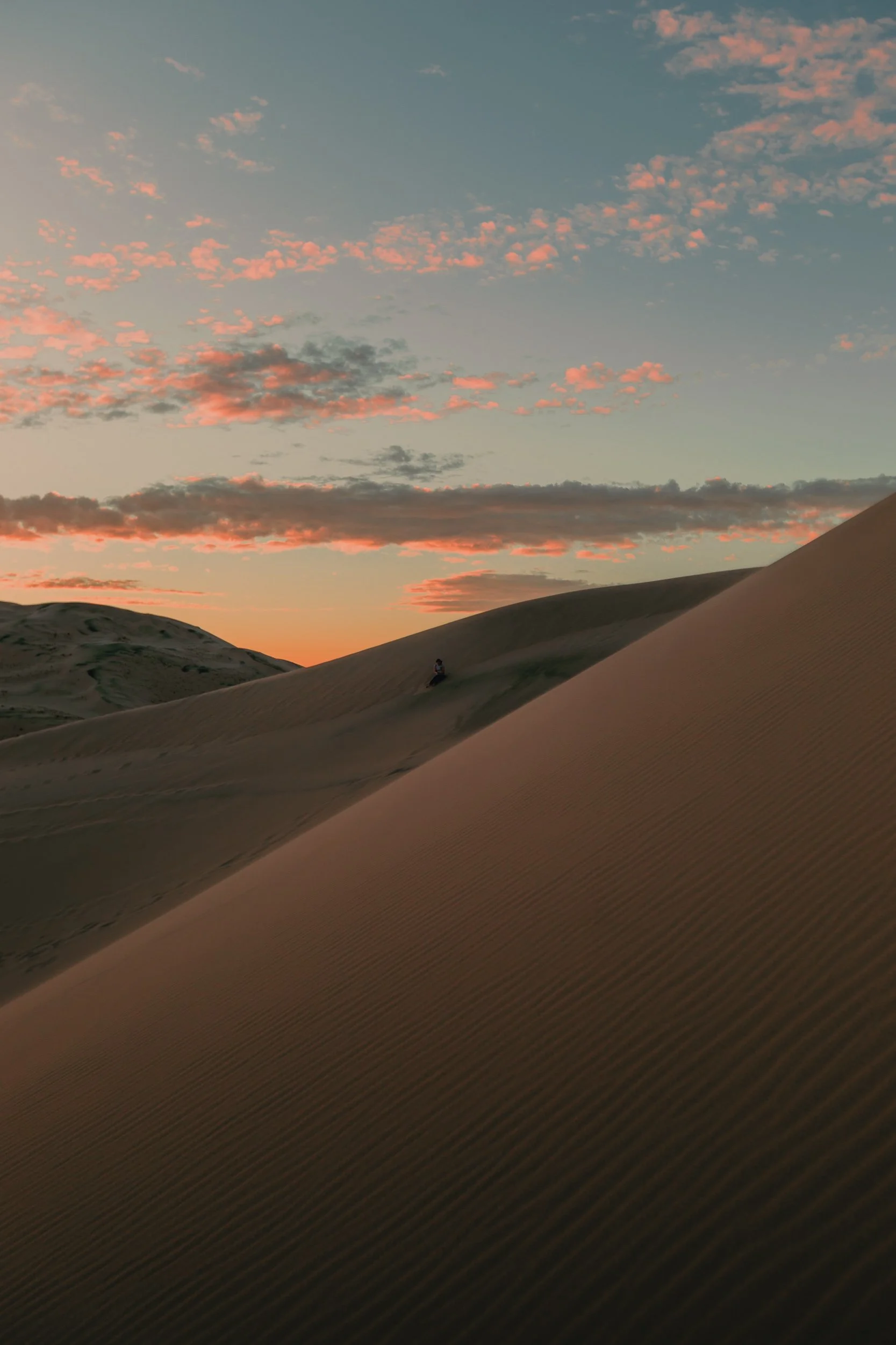 Sunset light across a sand dune ridge at Kelso Dunes in the Mojave Desert, golden hour landscape photography by James Brasier