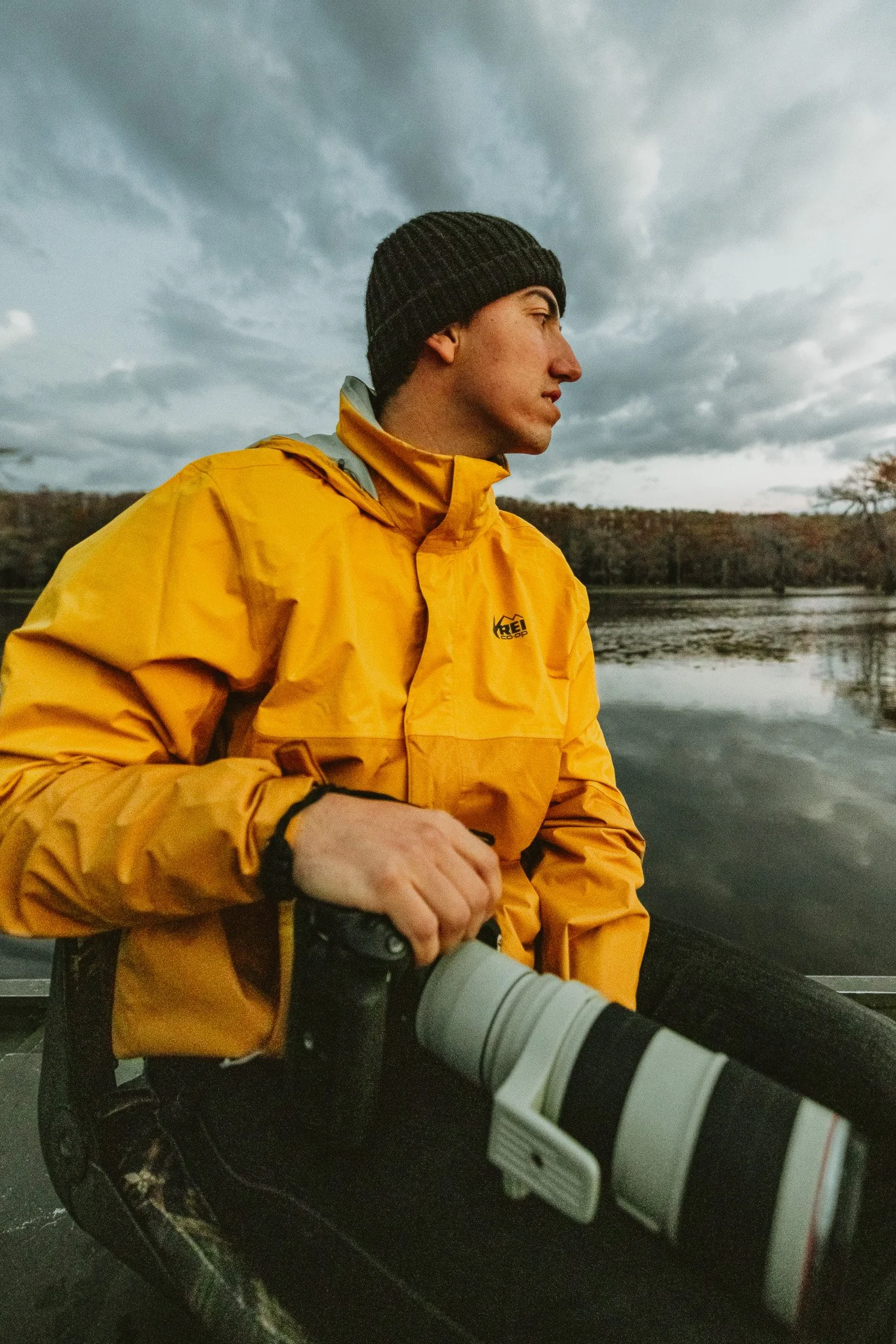 James Brasier on location at a lake with camera and telephoto lens, Colorado outdoor photographer
