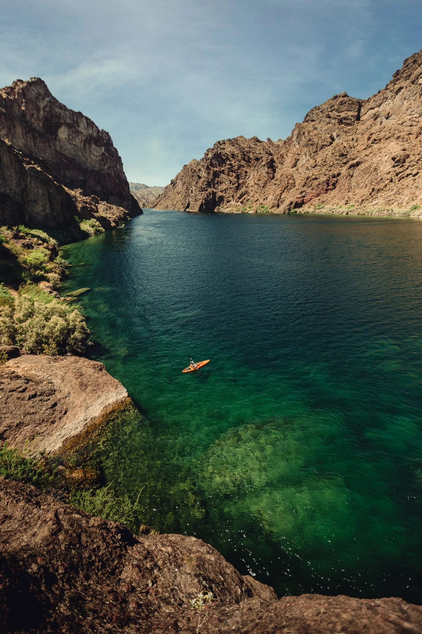 Kayaker in turquoise water at Emerald Cove on the Colorado River, aerial landscape photo by outdoor photographer James Brasier