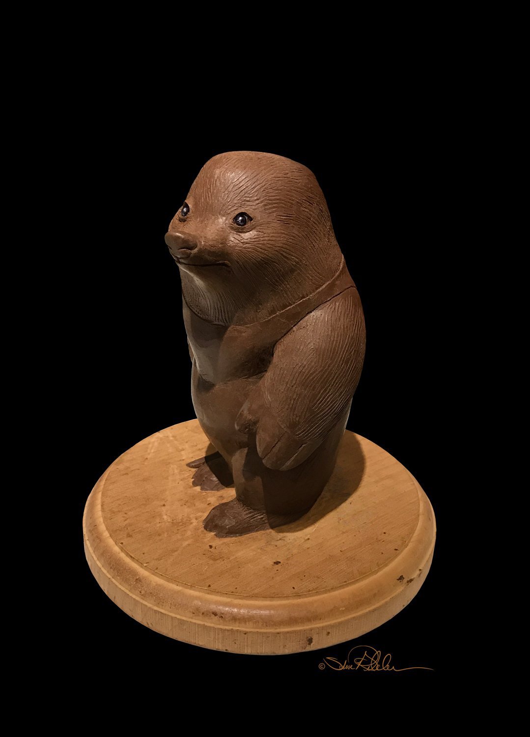 Sculpture in brown clay of mole character “Nosey” from the book titled “Over There.”