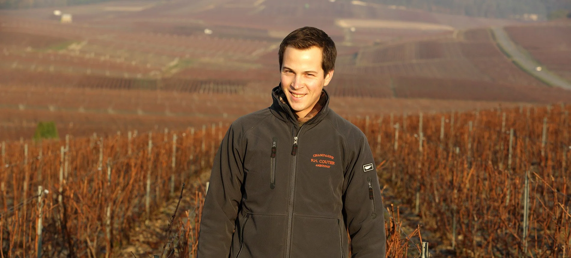Antoine Coutier standing among the family’s Grand Cru vineyards in Ambonnay