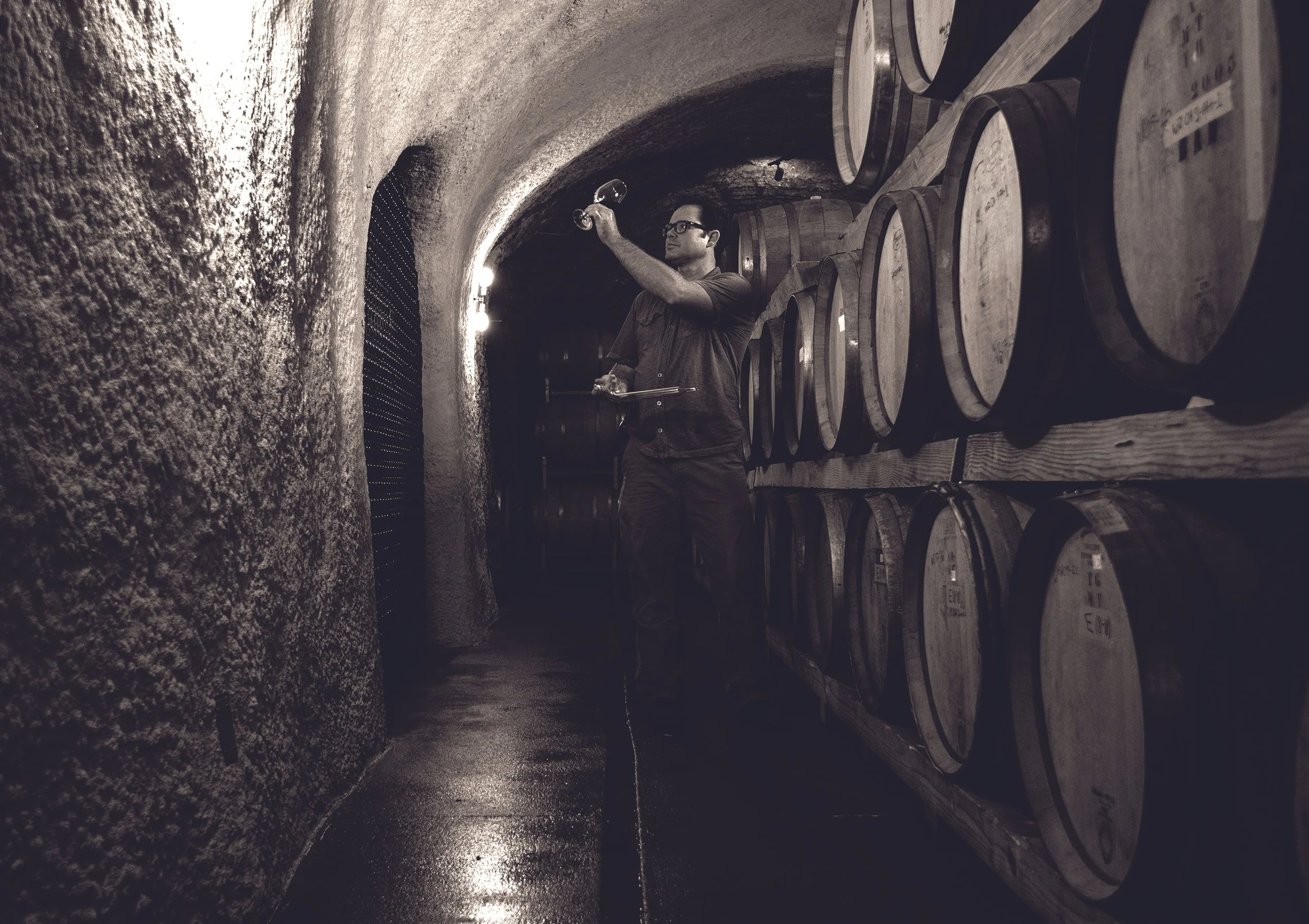 White Rock Vineyards winemaker Christopher Vandendriessche tasting wine in the estate cave