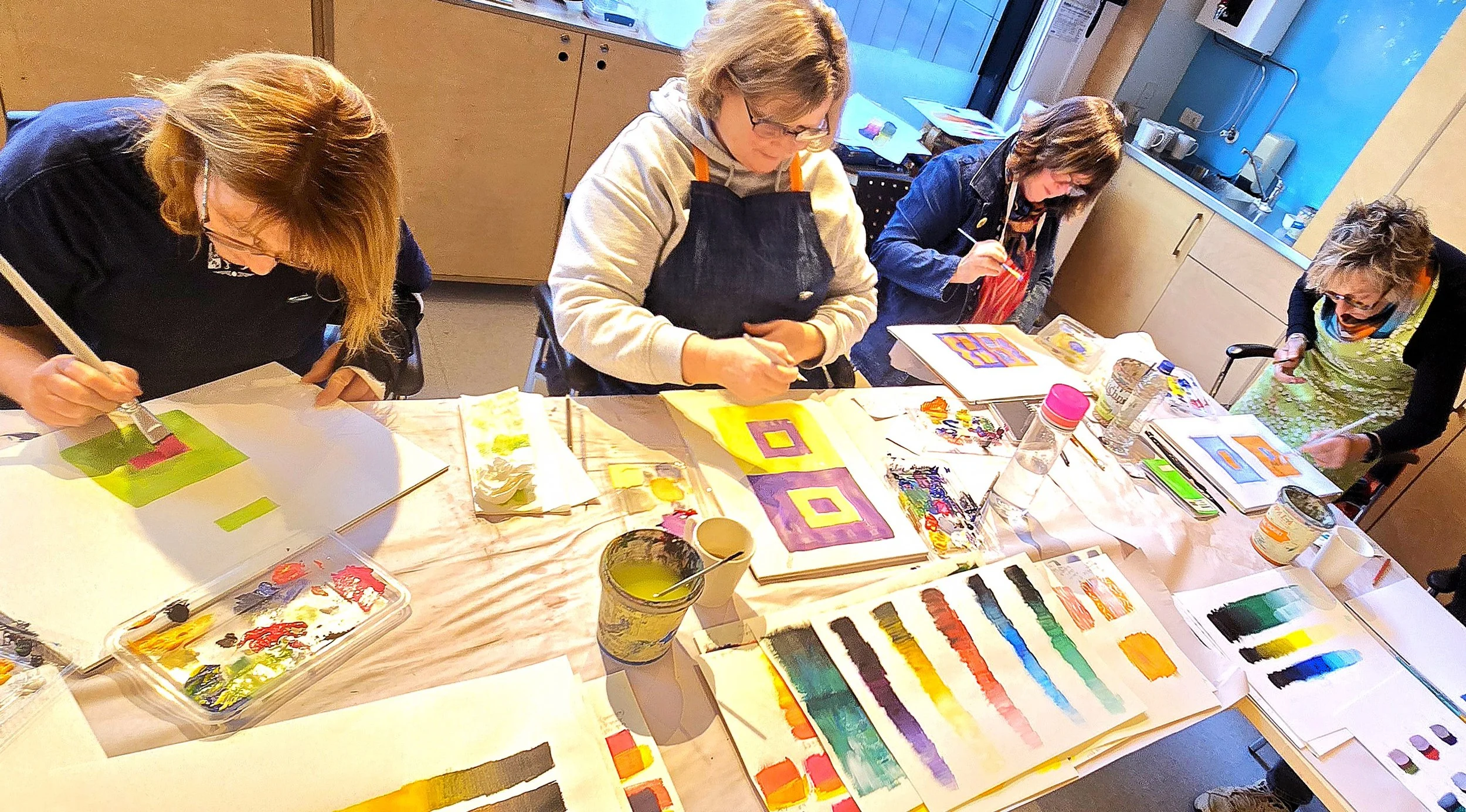 Art students painting with colour, making colour charts in Larisse Hall's Painting with colour simplified class