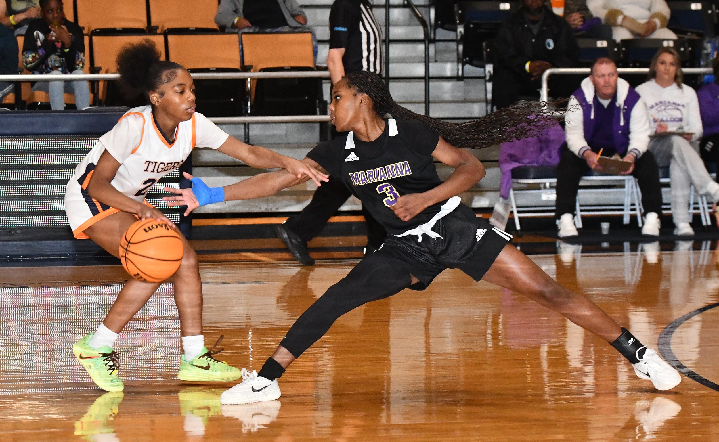 marianna malone girls 2 Indya Barnes 3 Ja'Shonna Mathis   Malone’s Indya Barnes dodges a grab by Marianna’s Ja'Shonna Mathis.