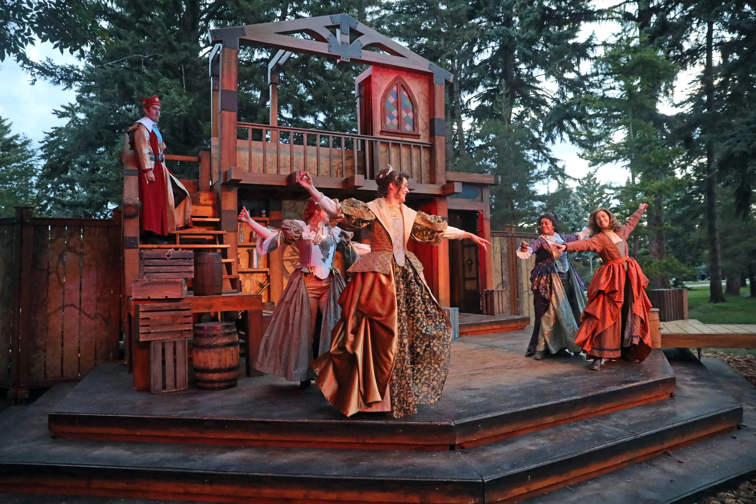 Cast members dance during the ball scene in The Three Musketeers at Montana Shakespeare in the Parks, including Emily Michelle Walton as Queen Anne.