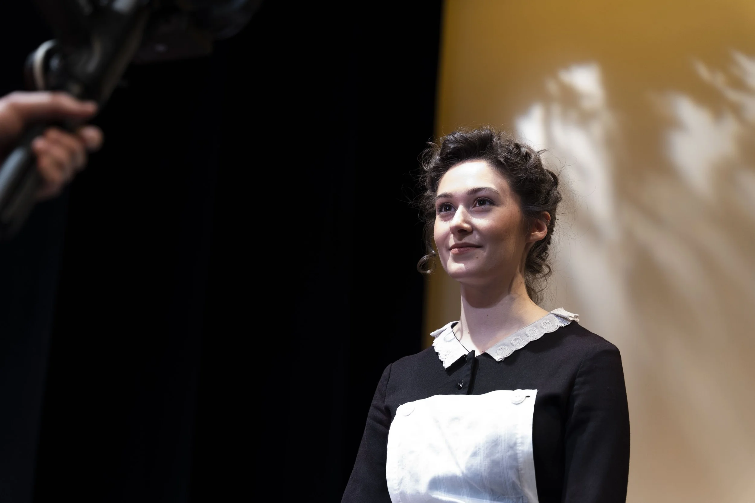Behind-the-scenes photo of Emily Michelle Walton as Phyllis, dressed as a Victorian maid, during filming for the pandemic-era virtual production of Passion, Poison, and Petrifaction, part of Shaw! Shaw! Shaw! at the Shakespeare Theatre of New Jersey.
