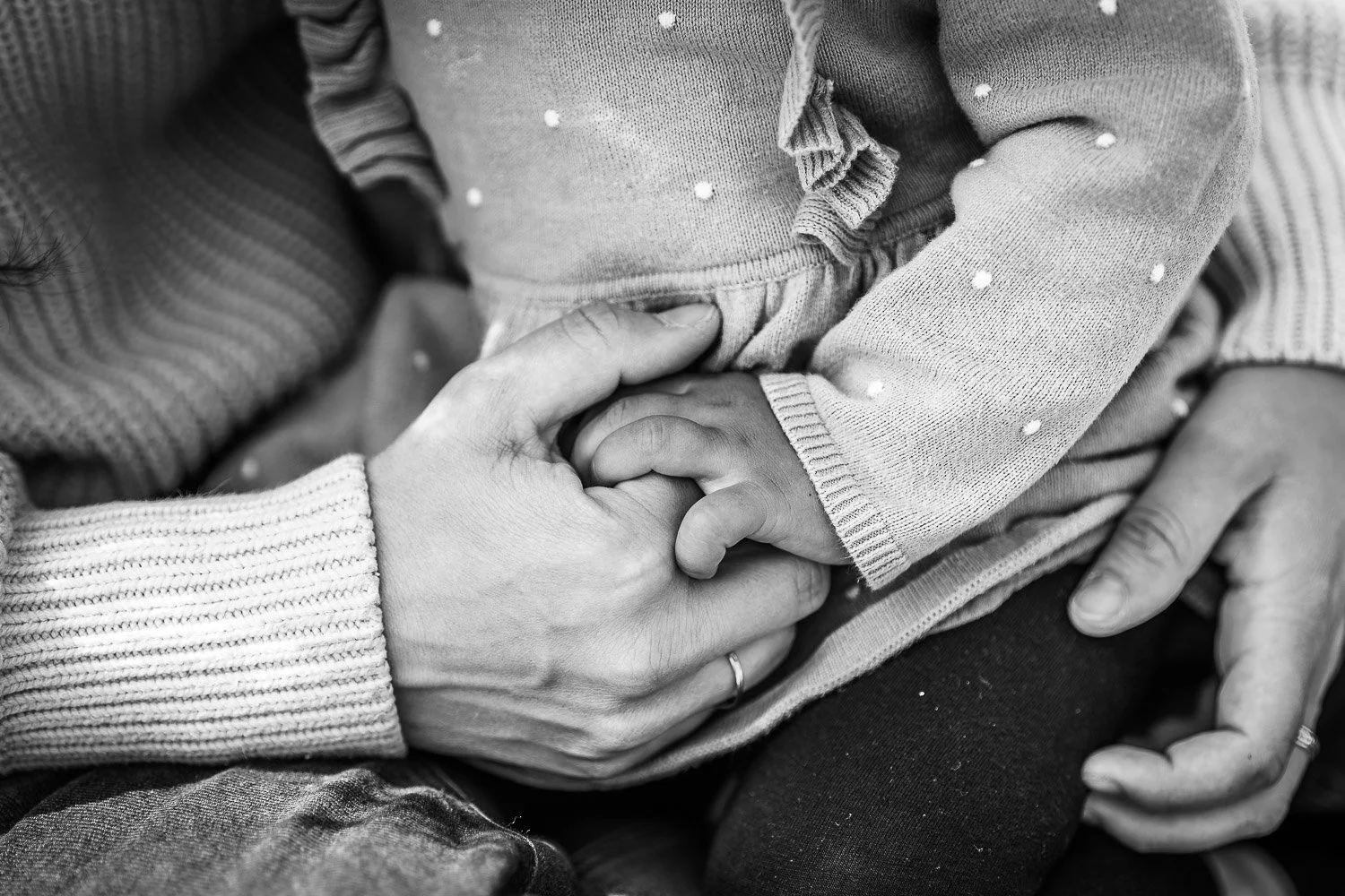 daughter holding moms hand