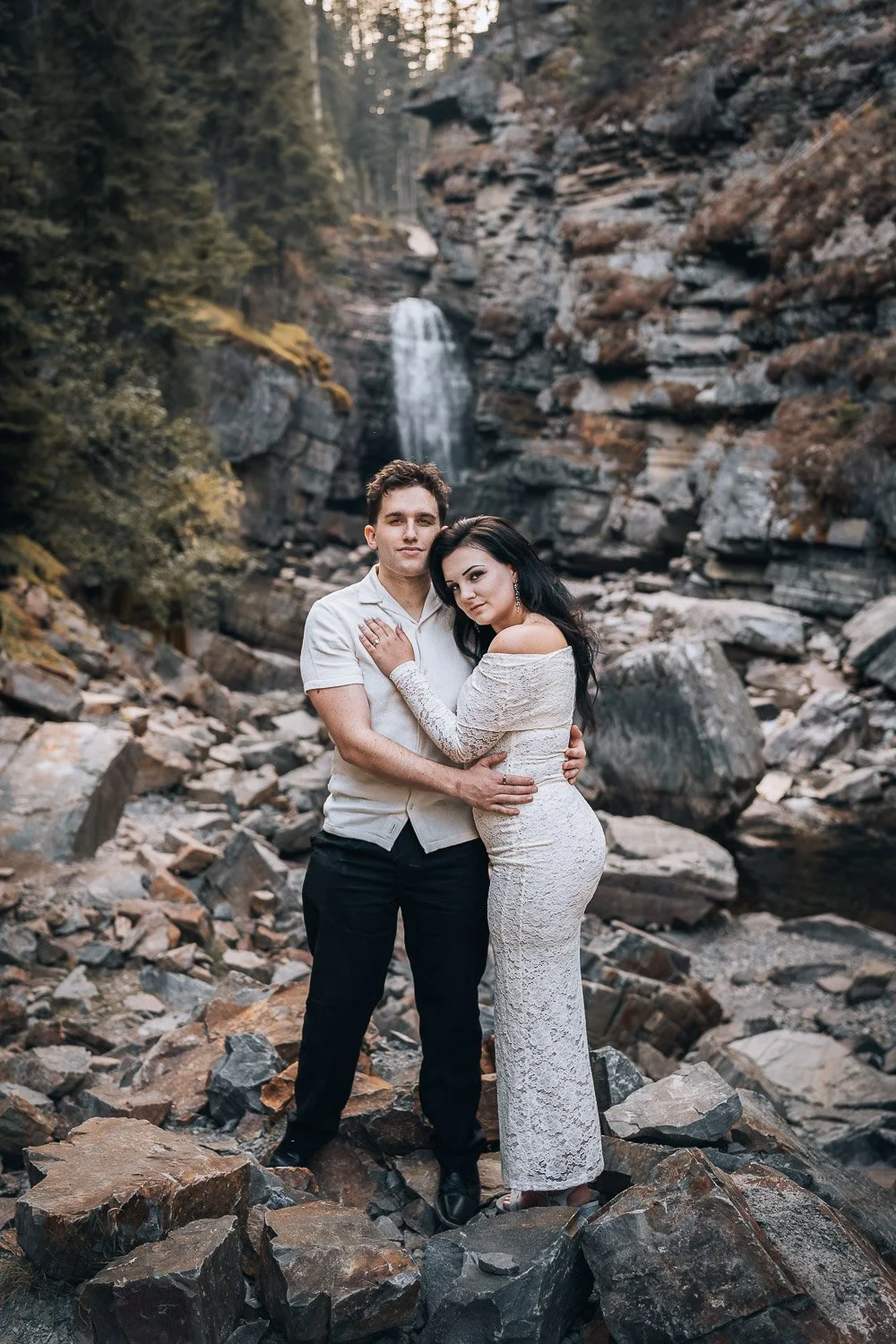 couple photography next to the waterfall