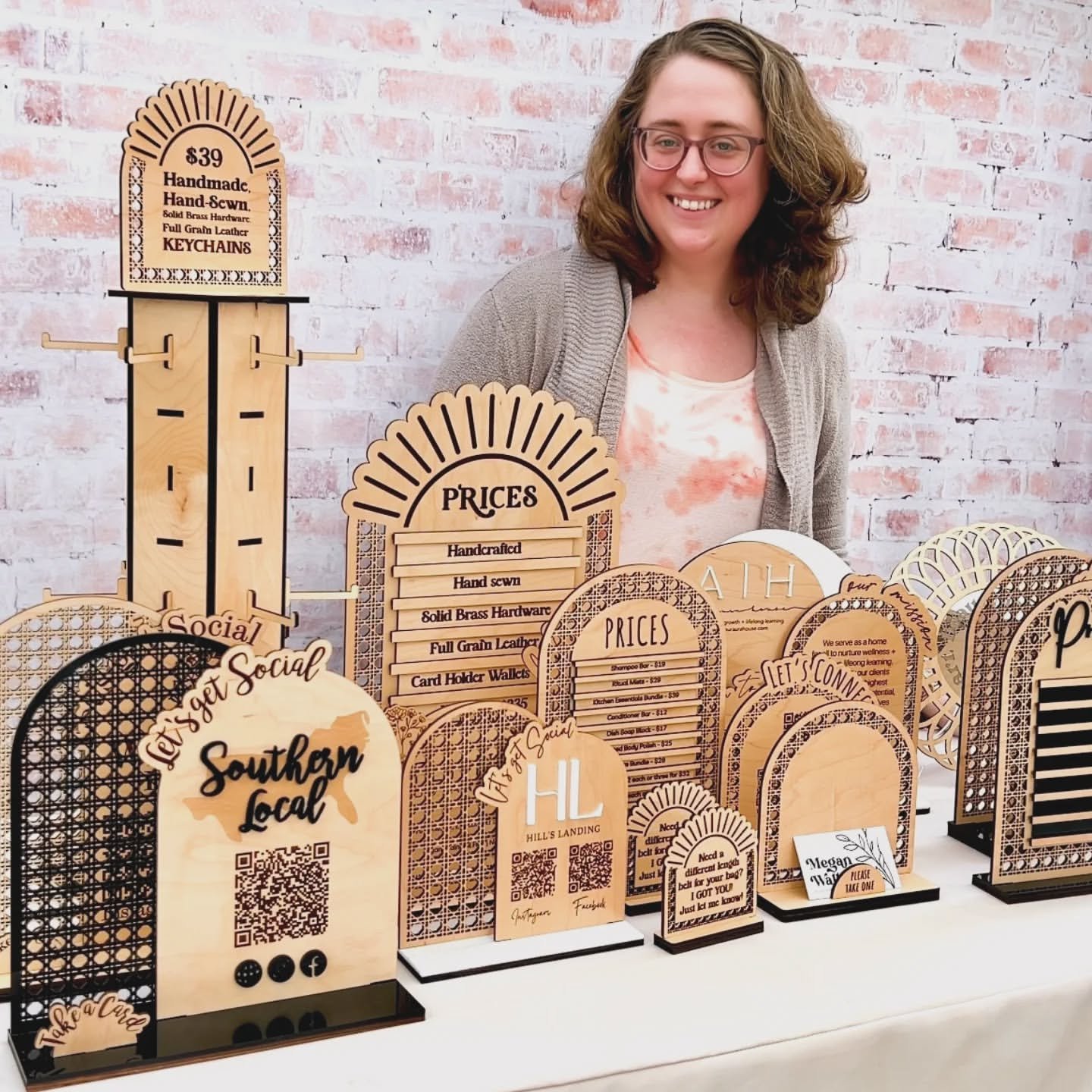 Megan Walker, founder of Arch Theory Displays in Ontario, CA, showcasing custom laser-engraved wood arch displays, QR code signs, and price boards at Rustic & Modern Collective.