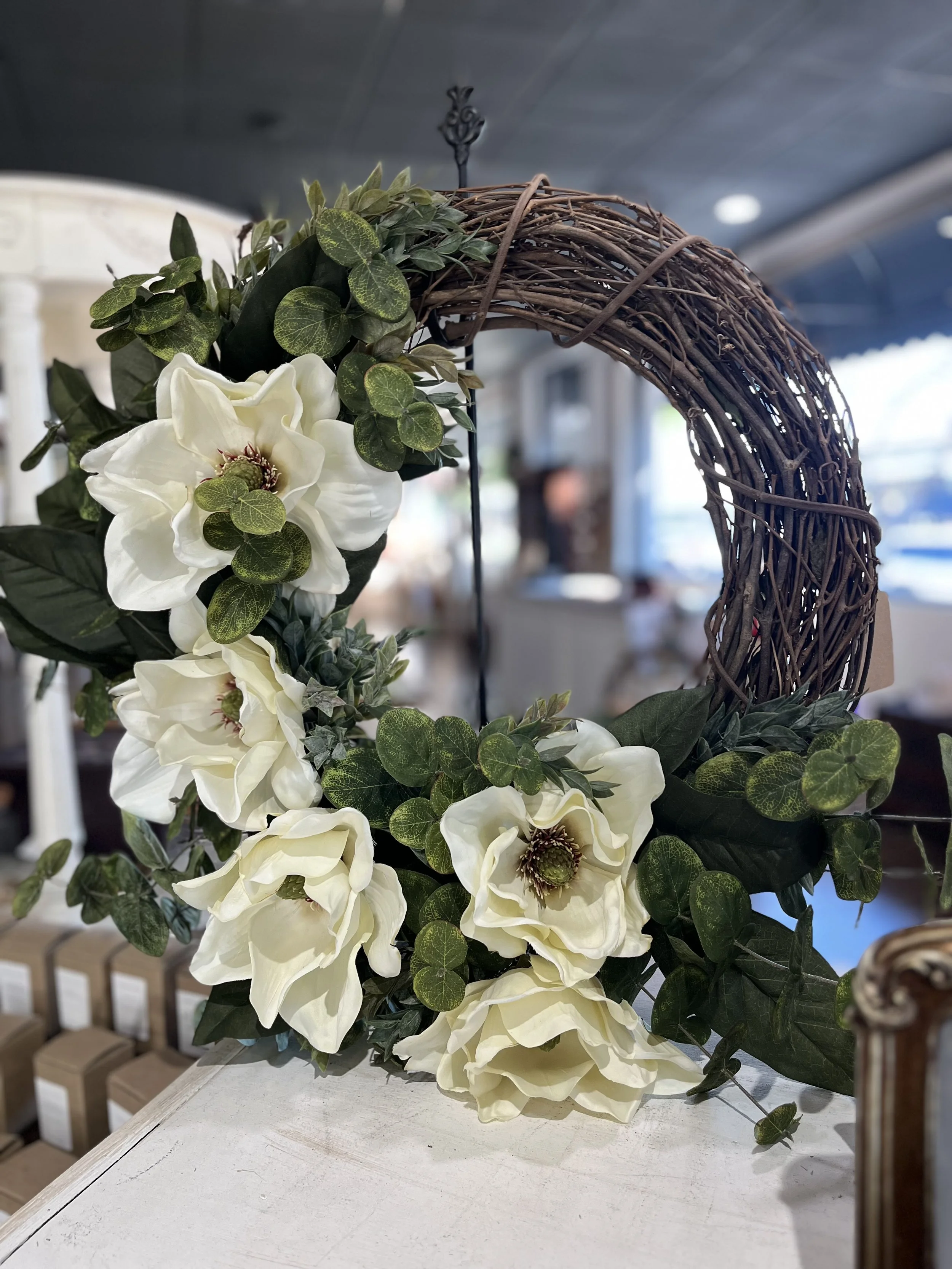 Handmade plush crochet chickens in assorted colors, displayed in a wooden crate. Cute and cozy décor or gift items available at Rustic and Modern Collective in Upland, CA.
