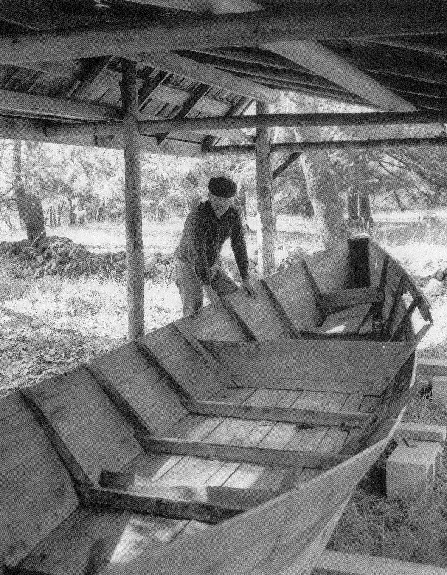 image of trey combs on rogue river looking at boat used by Zane Grey