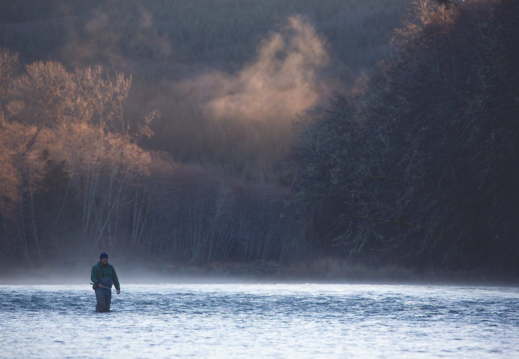 Image of Sol Duc River and man fly fishing