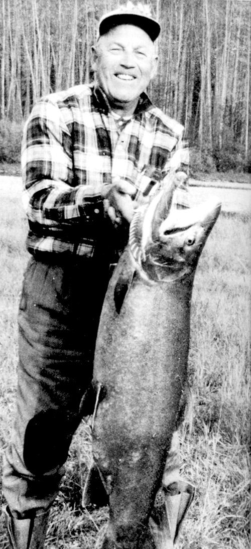 Karl Mausser holding a 33-pound steelhead from the Kispiox River, recognized as a fly-fishing world record in 1962