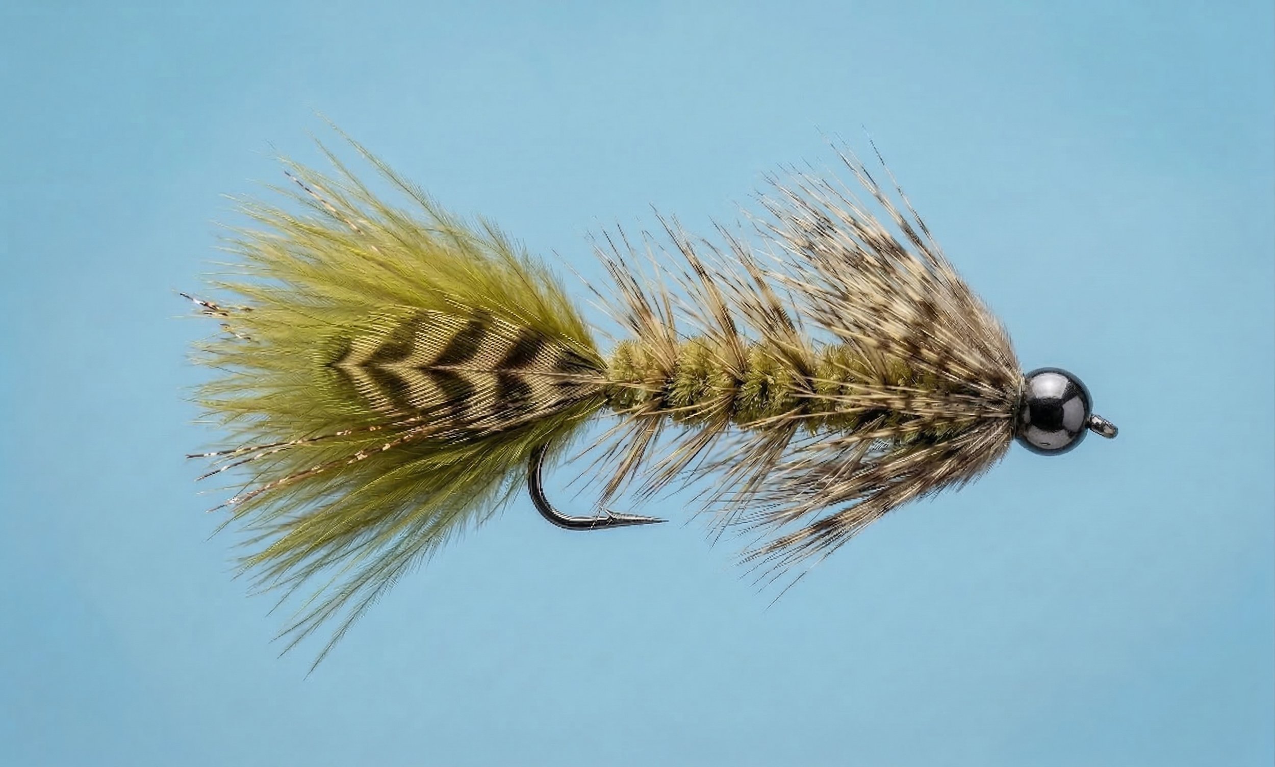 Olive Searcher steelhead fly pattern in natural olive and brown tones designed for clear water with marabou tail, barred mallard overlay, and partridge collar