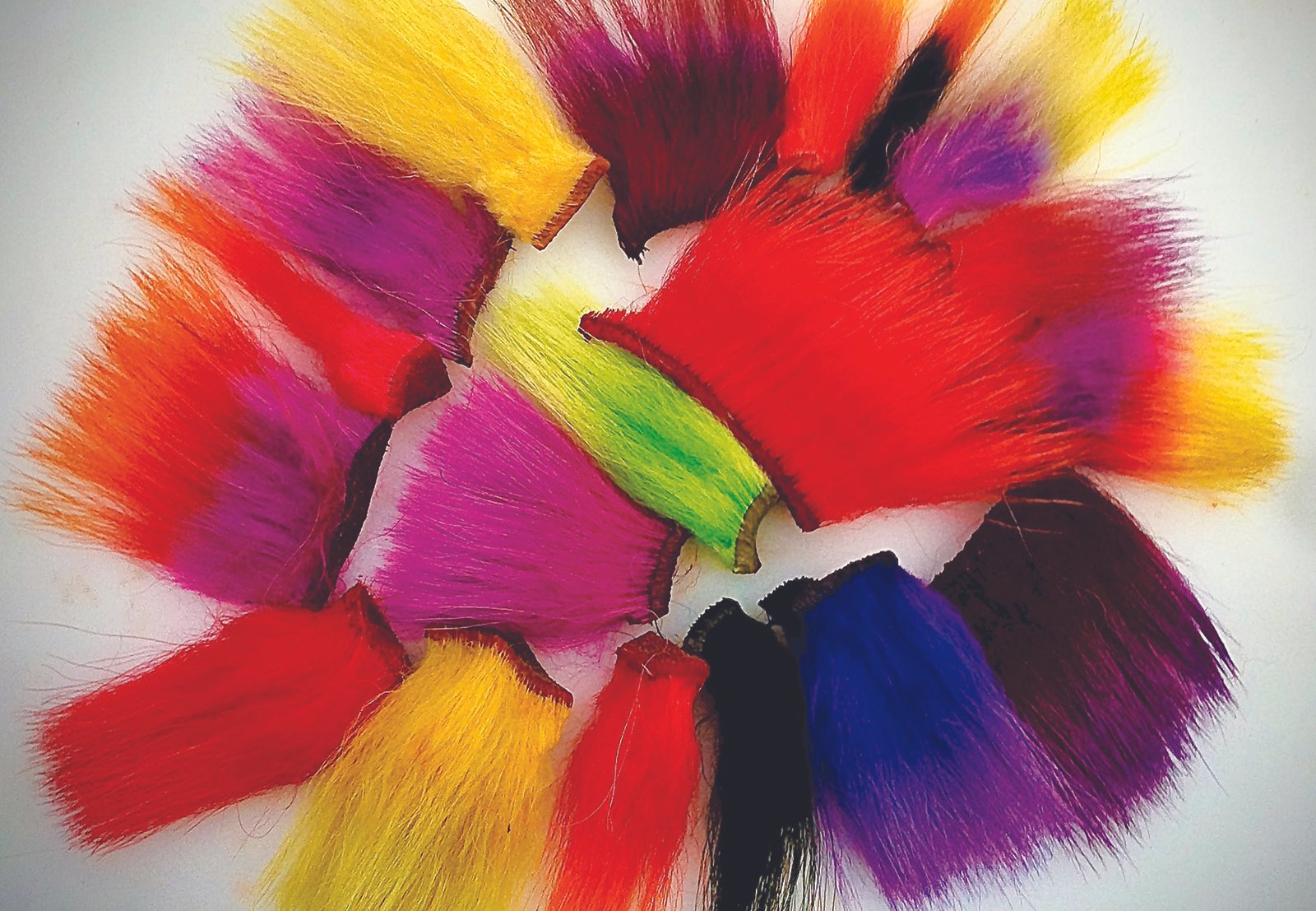 For years Dave McNeese has dyed select materials fluorescent white before dyeing them the desired color to give them a rich glow.