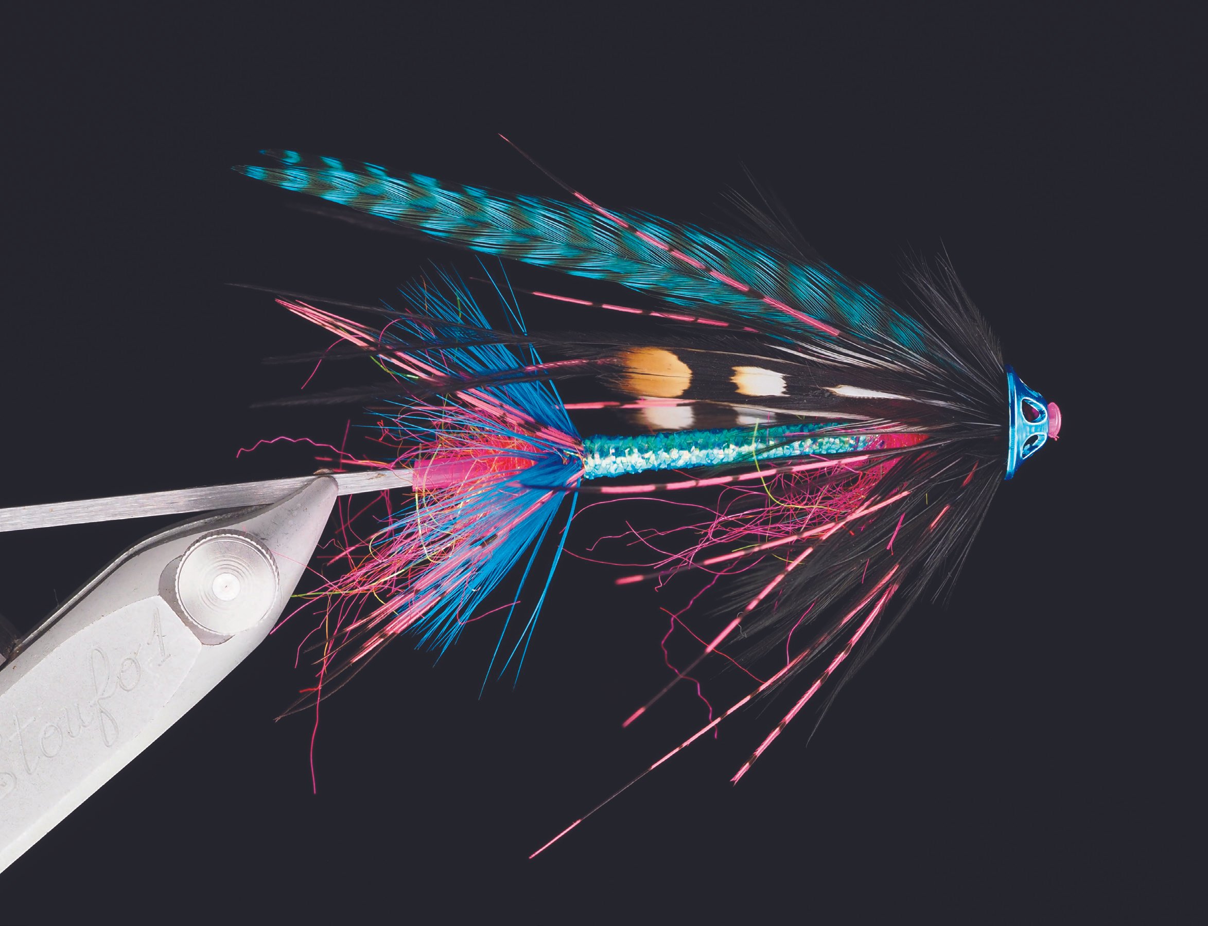 Skilled fly tier Jay Nicholas created Blue Dawn, this exquisite original Intruder for this book’s deluxe edition framed fly plate.