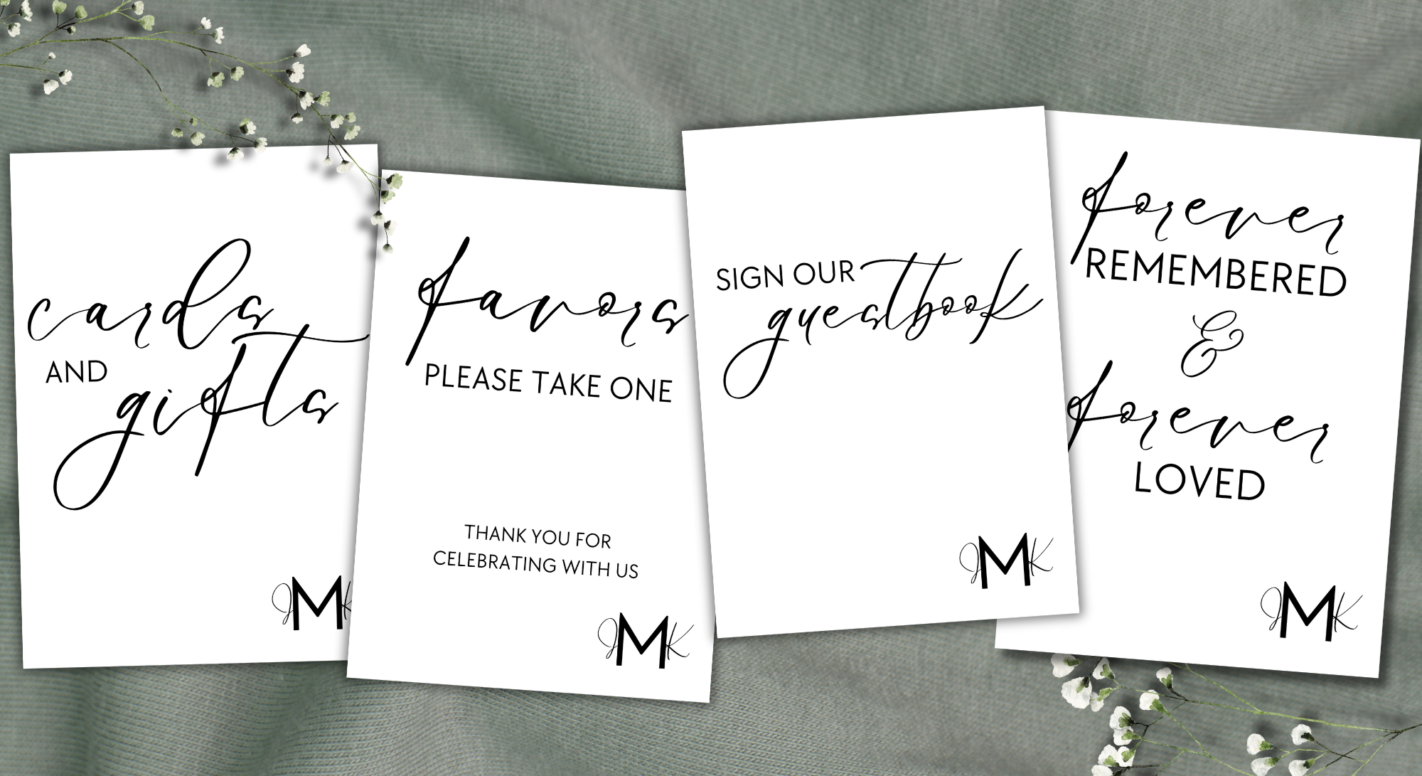 Four white cards with black cursive and printed text on a grey fabric background, accompanied by small white flowers. The cards contain messages about wedding or celebration activities, such as 'cards and gifts,' 'favors please take one,' 'sign our guestbook,' and 'forever remembered & forever loved.'