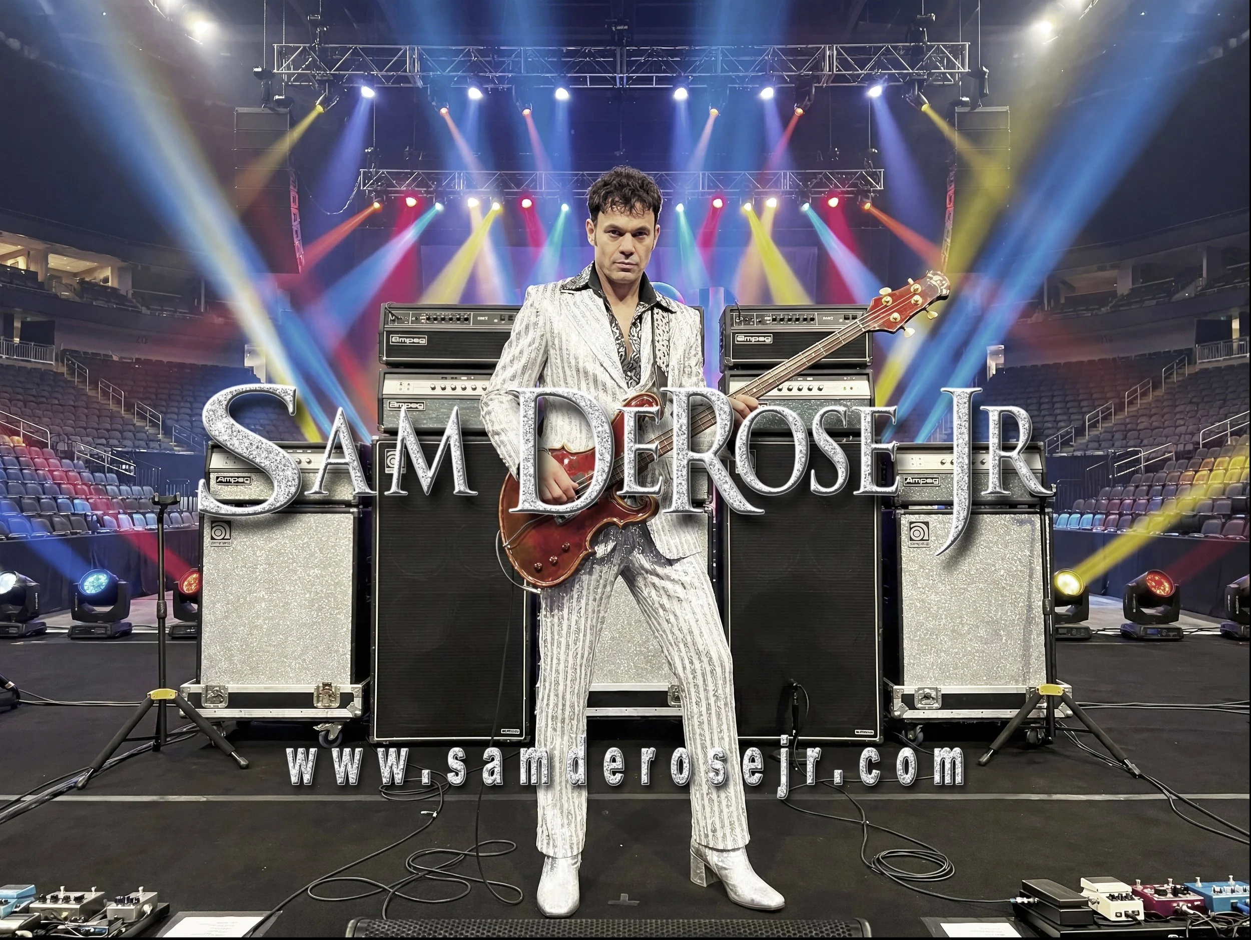 A man in a silver patterned suit holding a guitar on a stage with colorful lighting and amplifiers, with the text 'SAM DEROSE' across the bottom and a website URL.