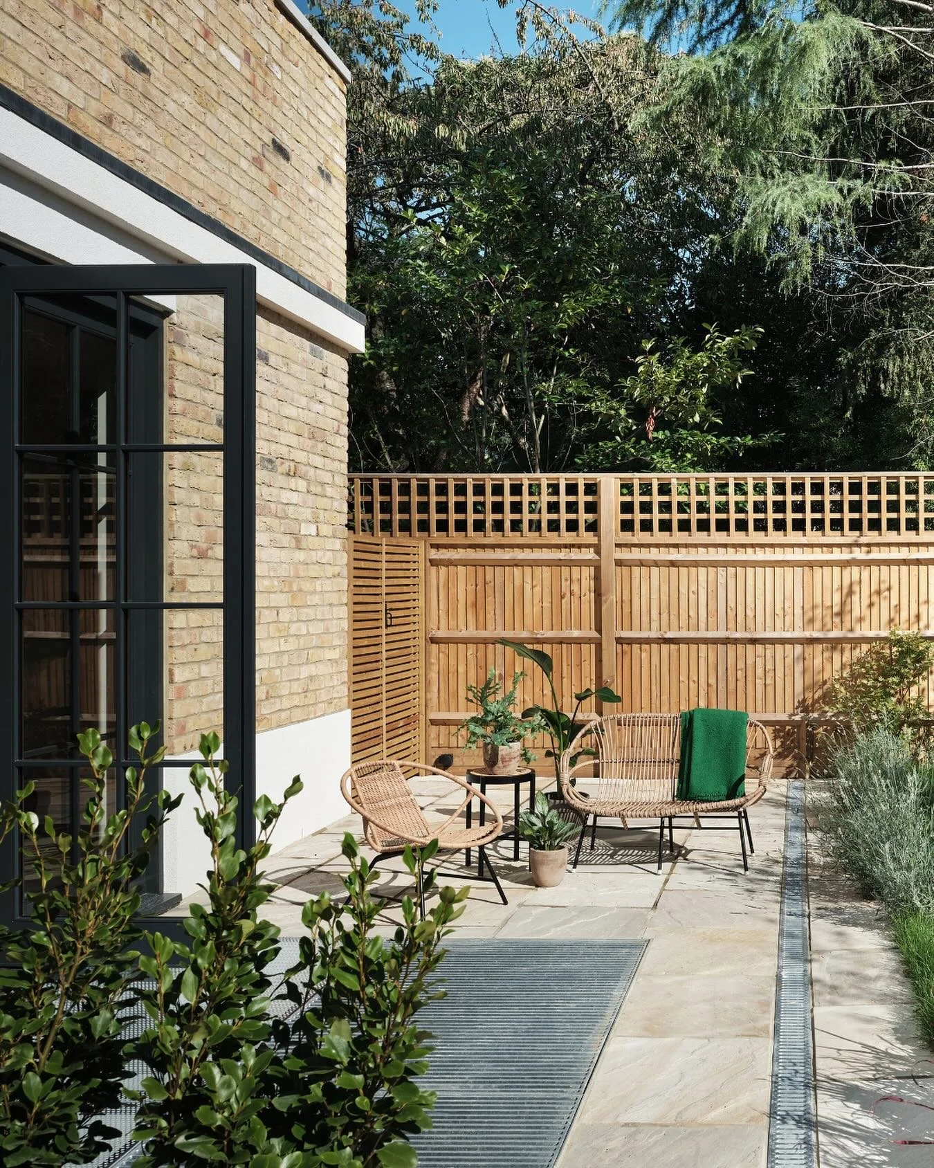 Outdoor spaces are an extension of the home, creating a stronger connection to nature. This patio links seamlessly with the interior through full-length doors, allowing light, air and vistas to flow freely between indoors and out.
Whether it’s