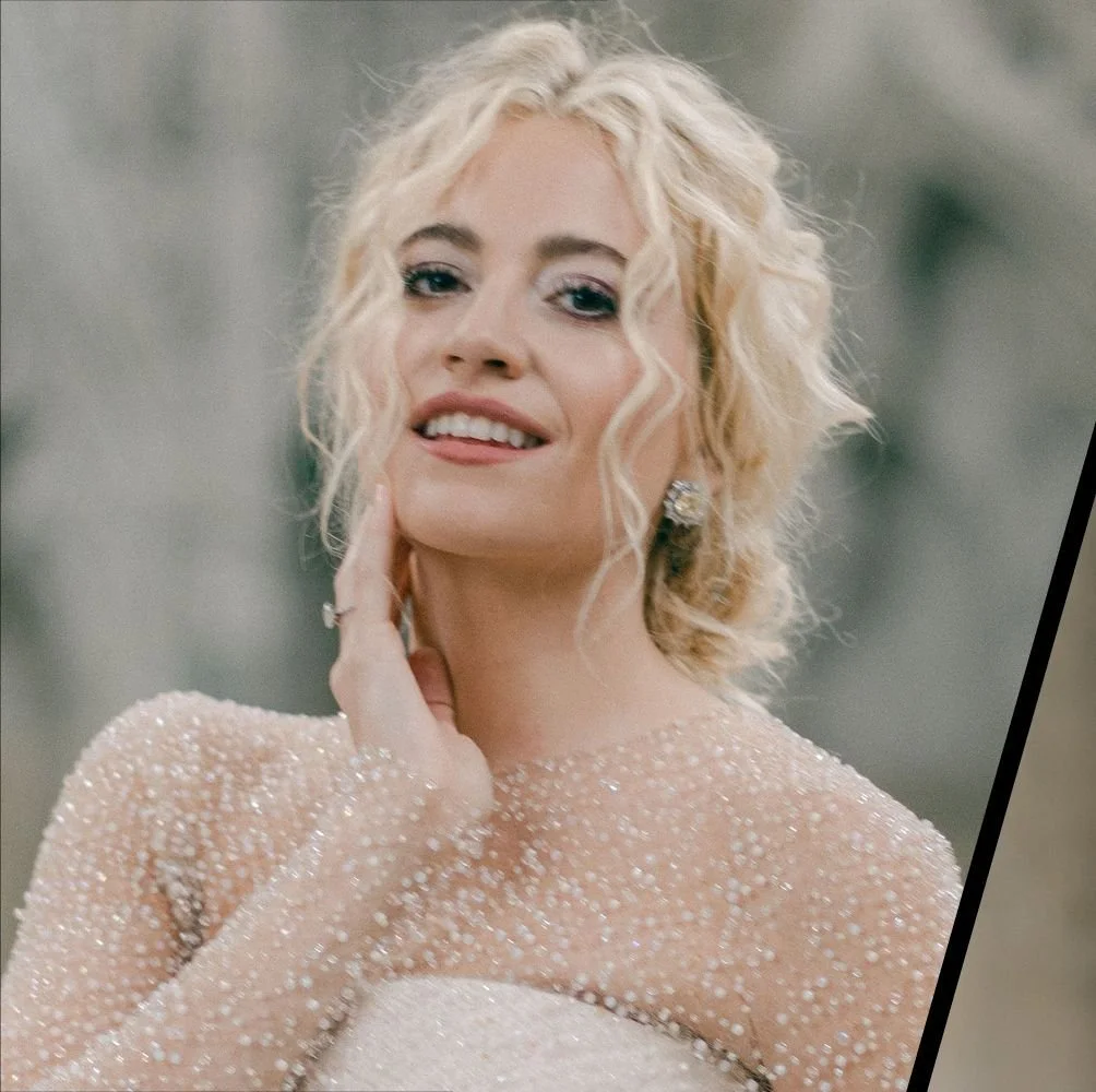 Pixie Lott wearing Boudoir Lashes by Asma Docrat on her wedding day at Ely Cathedral. A woman with curly platinum blonde hair, wearing a sparkly, sheer dress and elegant earrings, posing outdoors.