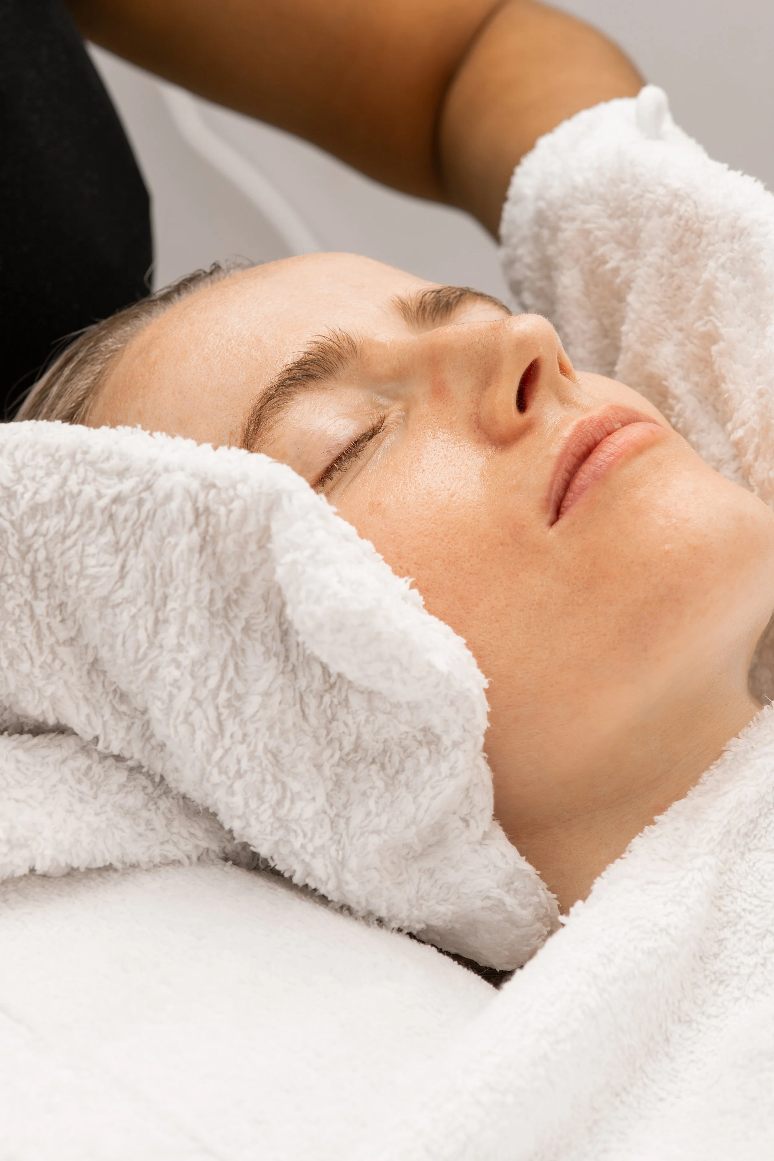 IMAGE OF A CLIENT GETTING A HOLISTIC FACIAL IN LONDON