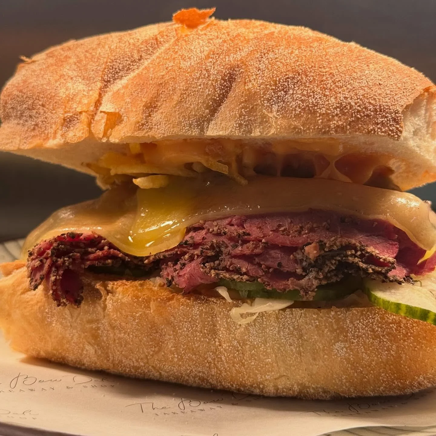 DELI REUBEN under the light ✨ 
house salt beef, sauerkraut, cheese, dill pickles, crispy potatoes, house sauce 😋 &pound;9.50