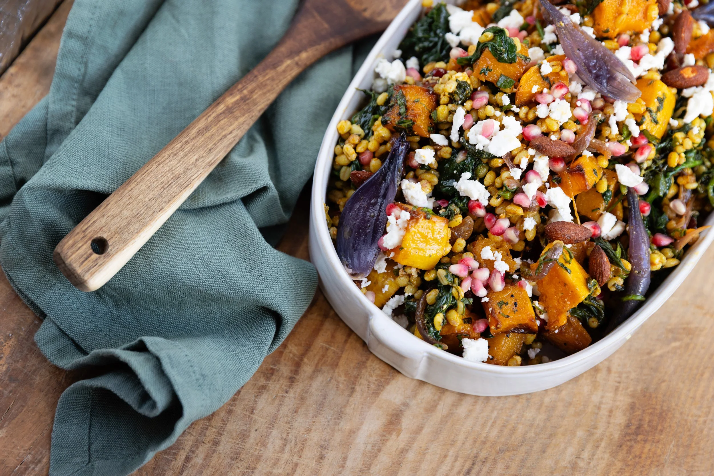 Barley Salad: Barley, roasted squash and red onion with feta, mint, seeds and pomegranate in a ginger & coriander dressing.