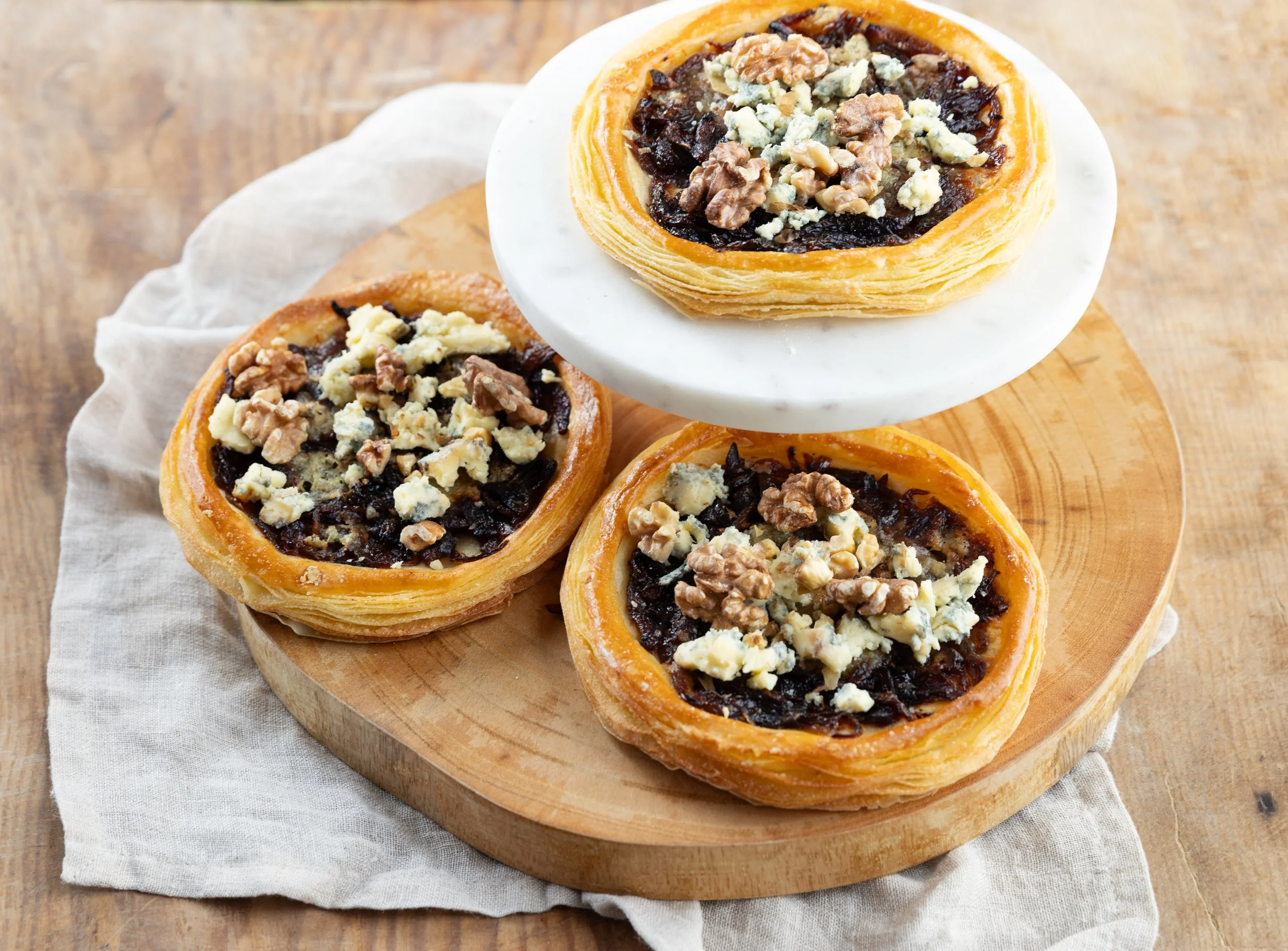Caramelised Onion, Blue Cheese and Walnut Tarts: Buttery, flaky, pastry tarts combining sweet caramelised onion, blue cheese and walnuts.