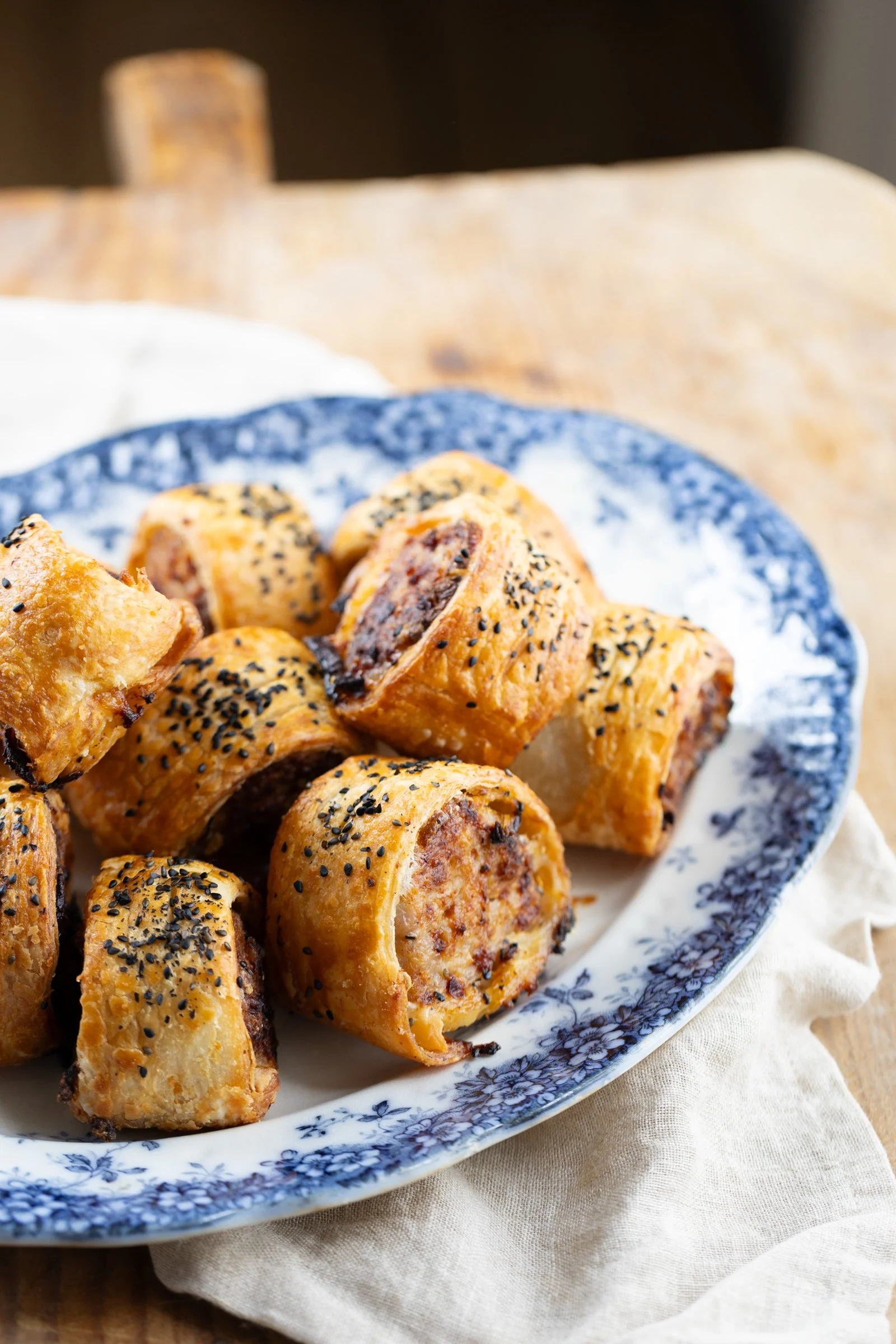 Mini Sausage Rolls: Golden, flaky pastry wrapped around a savoury sausage filling.