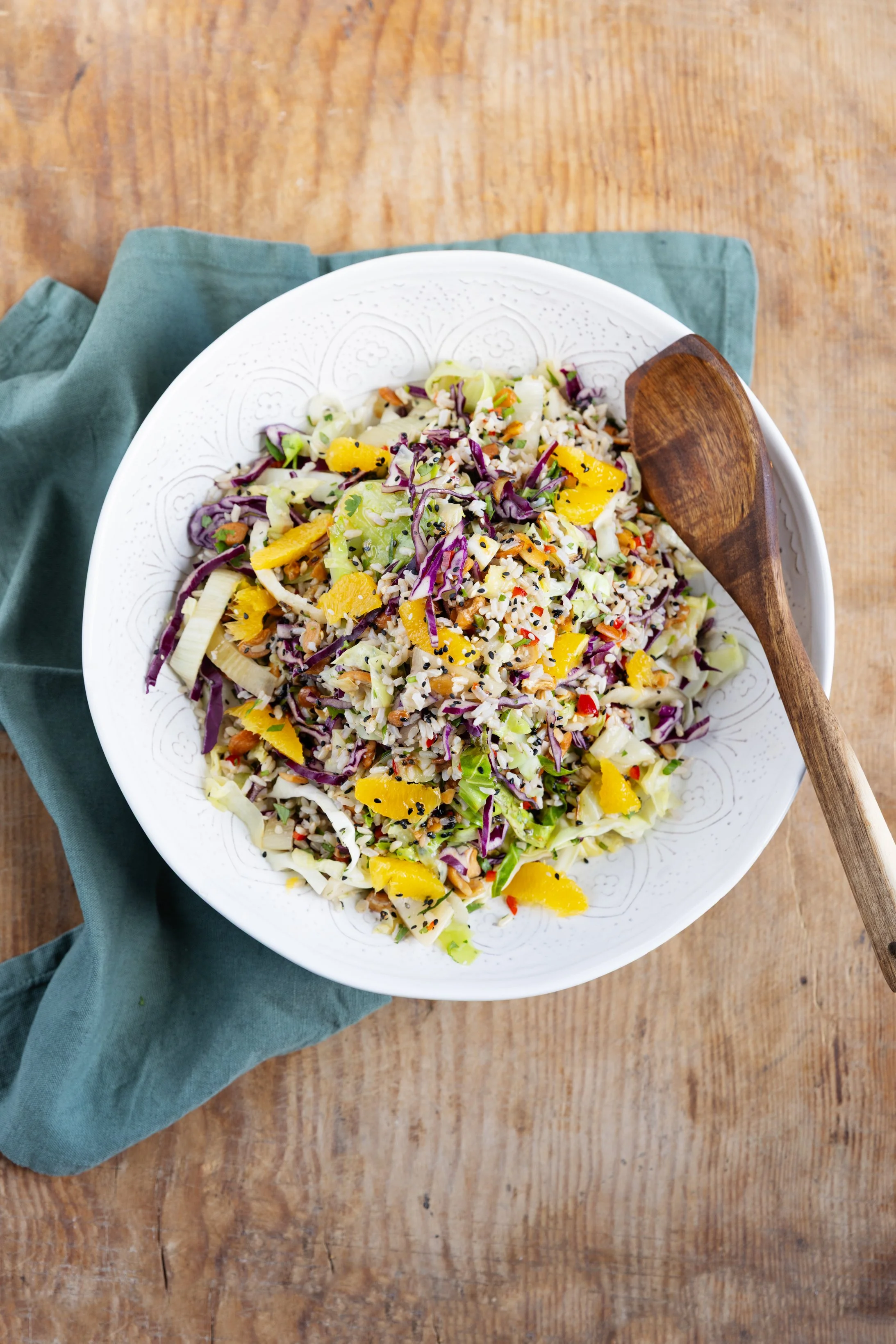 Thai Cabbage Salad: A colourful mix of brown rice, fennel, cabbage, orange, chilli, sesame and coriander with a soy and hoisin dressing.
