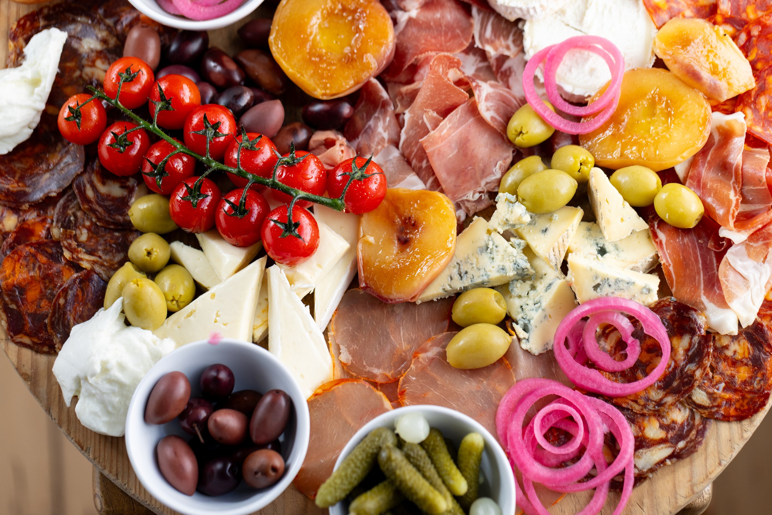 PBF Charcuterie Board: A generous board of cured meats, cheeses and accompaniments, ready to share.