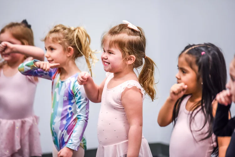 Young AIM dancers participating in class