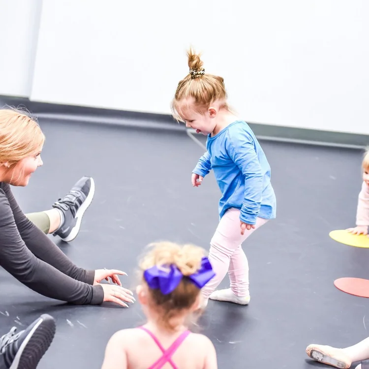 Young children enjoying movement at AIM