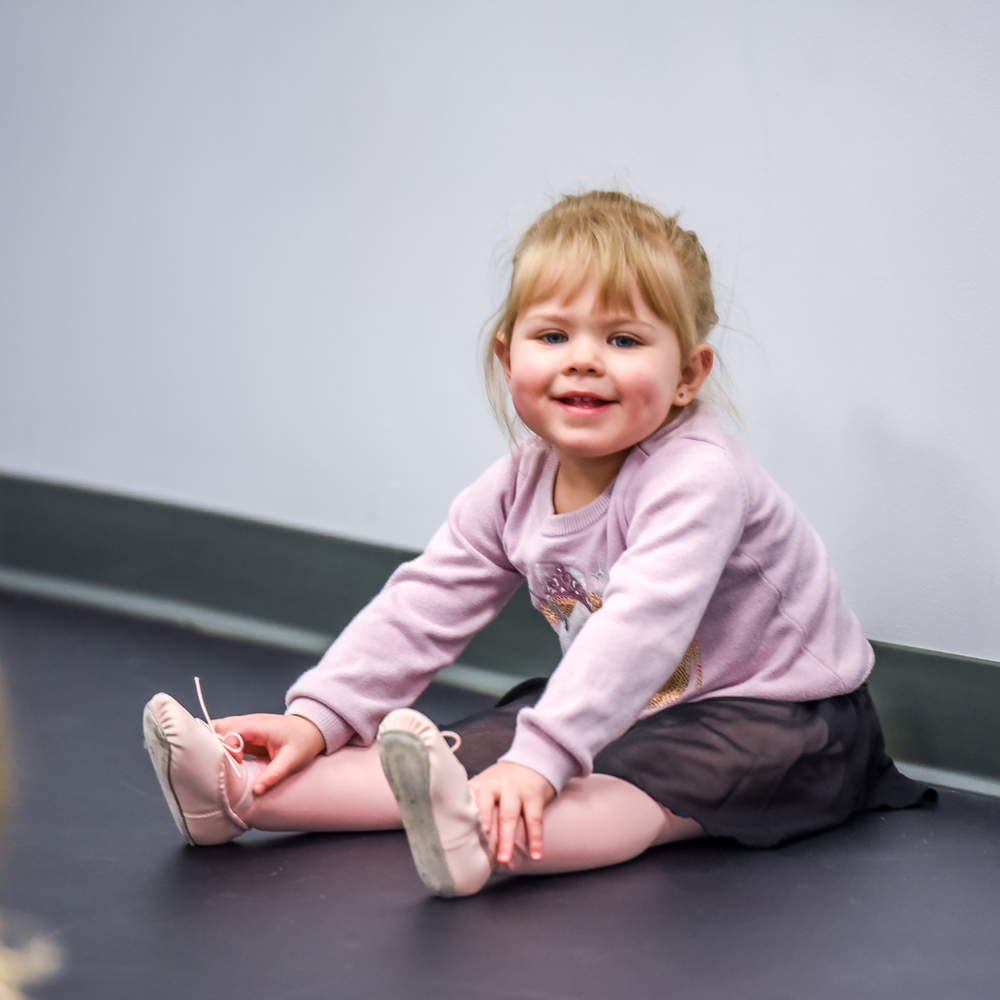 Young AIM dancer wearing ballet shoes