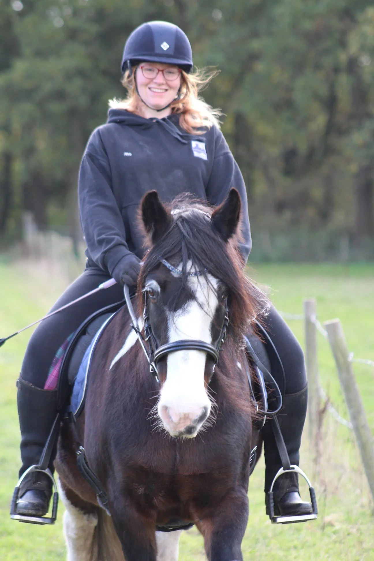 Rhiannon is riding her horse after completing the horse core exercise programme.
