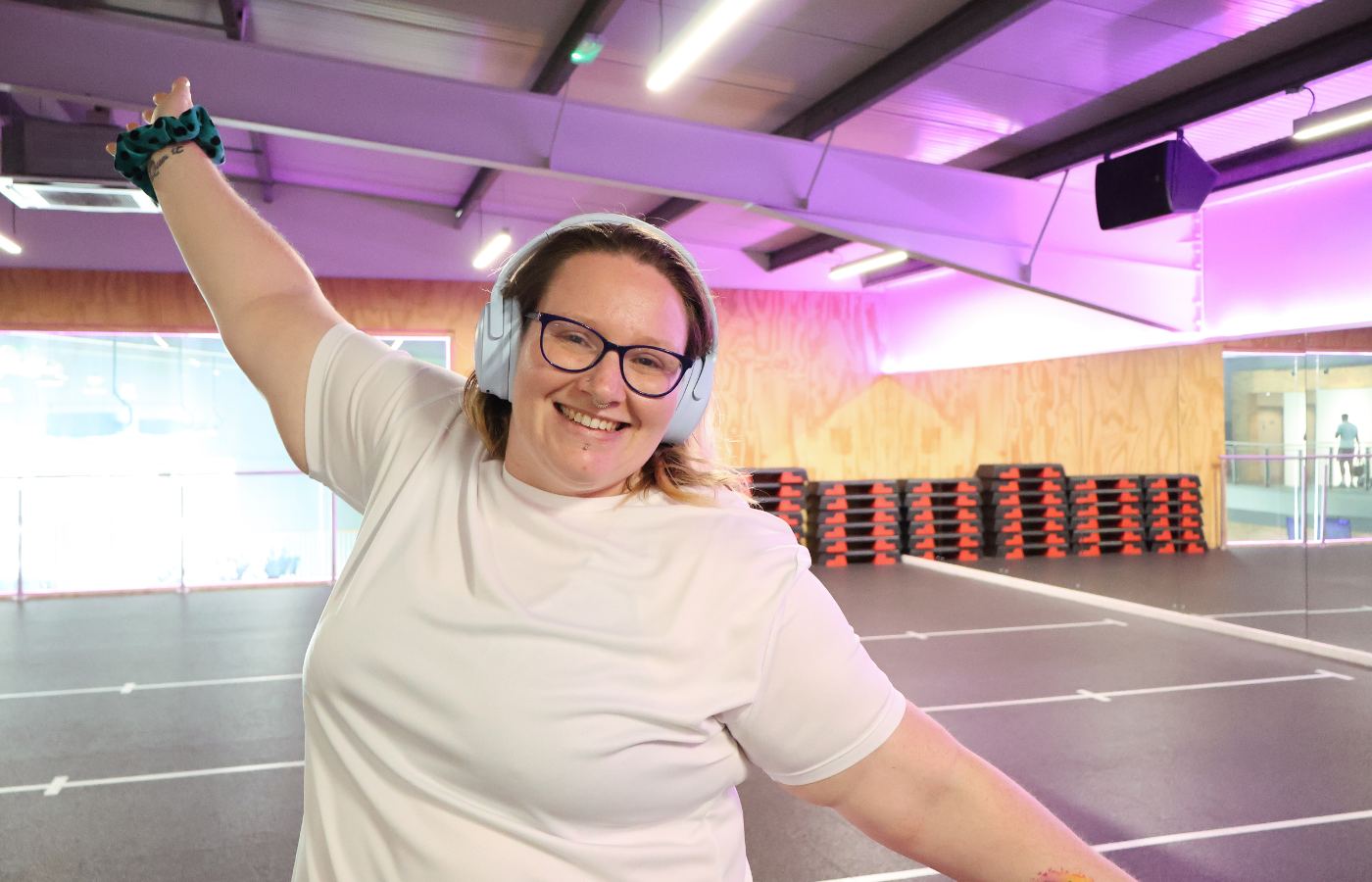 A photo of Rhiannon Cooper in a gym fitness studio.