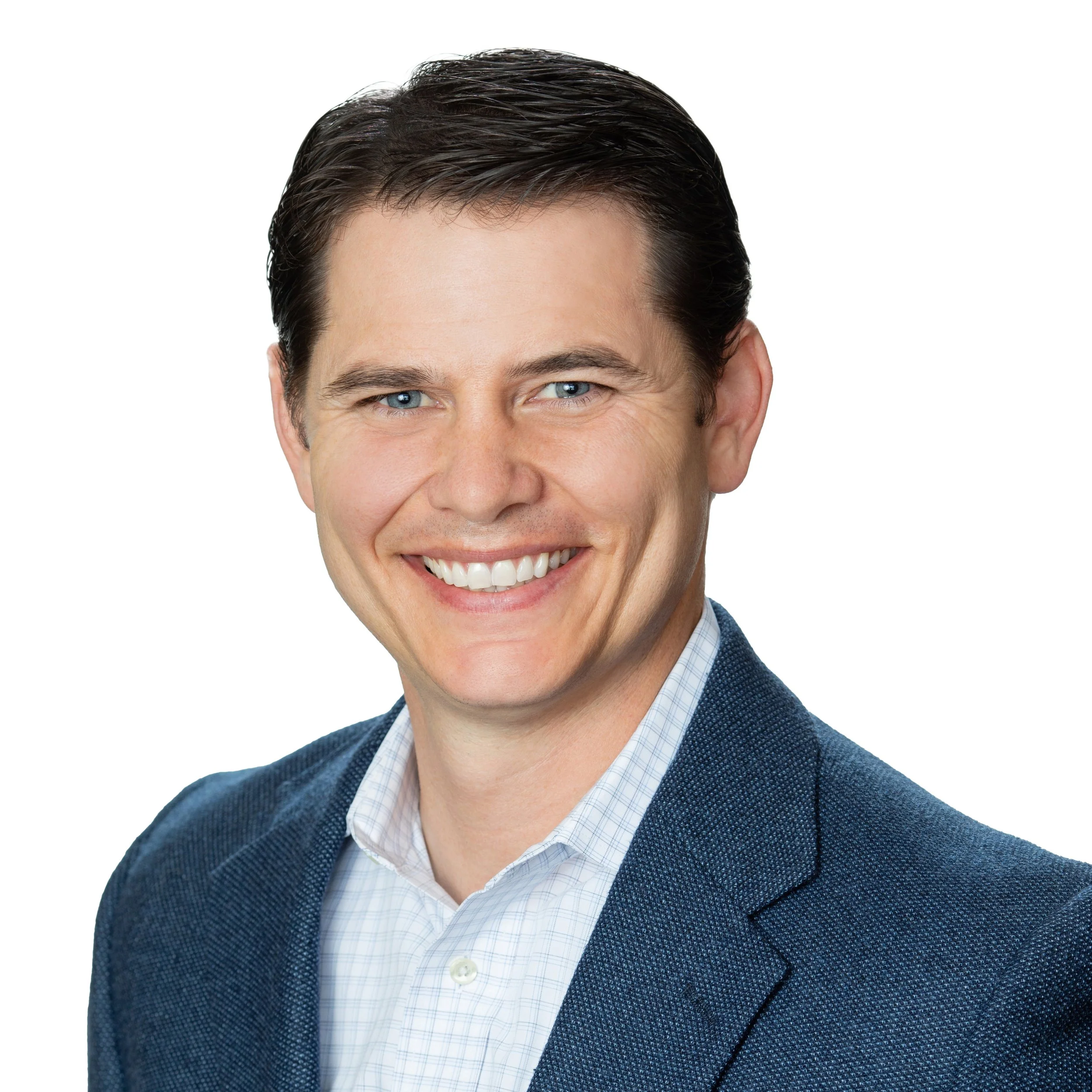 Professional headshot of a smiling man with dark hair, wearing a blue blazer and white shirt, against a white background.