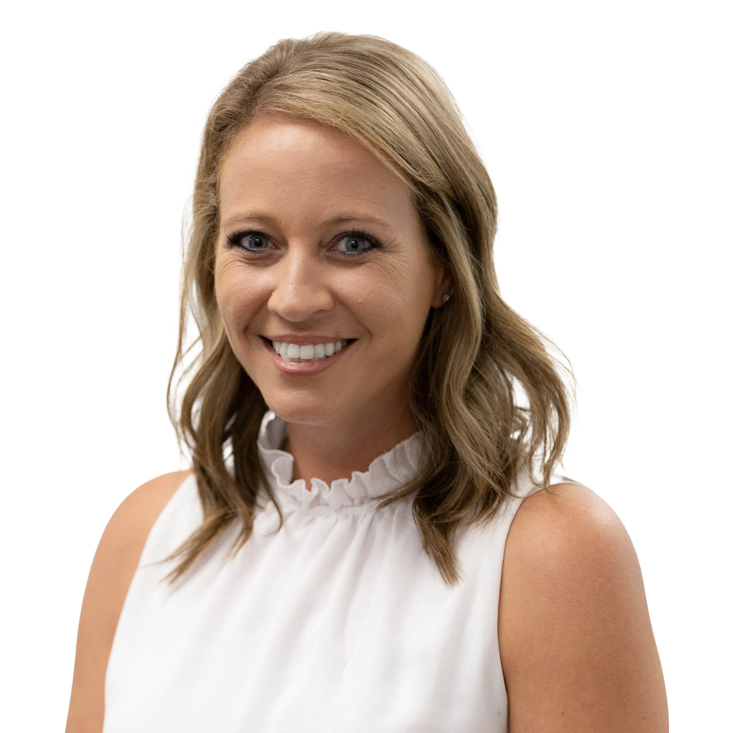 A smiling woman with shoulder-length light brown hair, blue eyes, wearing a sleeveless white top with a ruffled collar, against a white background.