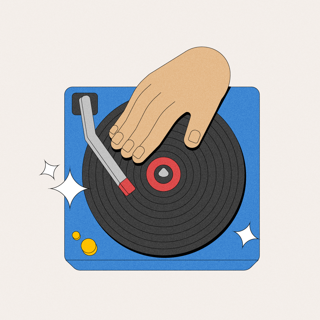 A hand operating a turntable on a blue surface, with one yellow coin and star-shaped sparkles nearby.