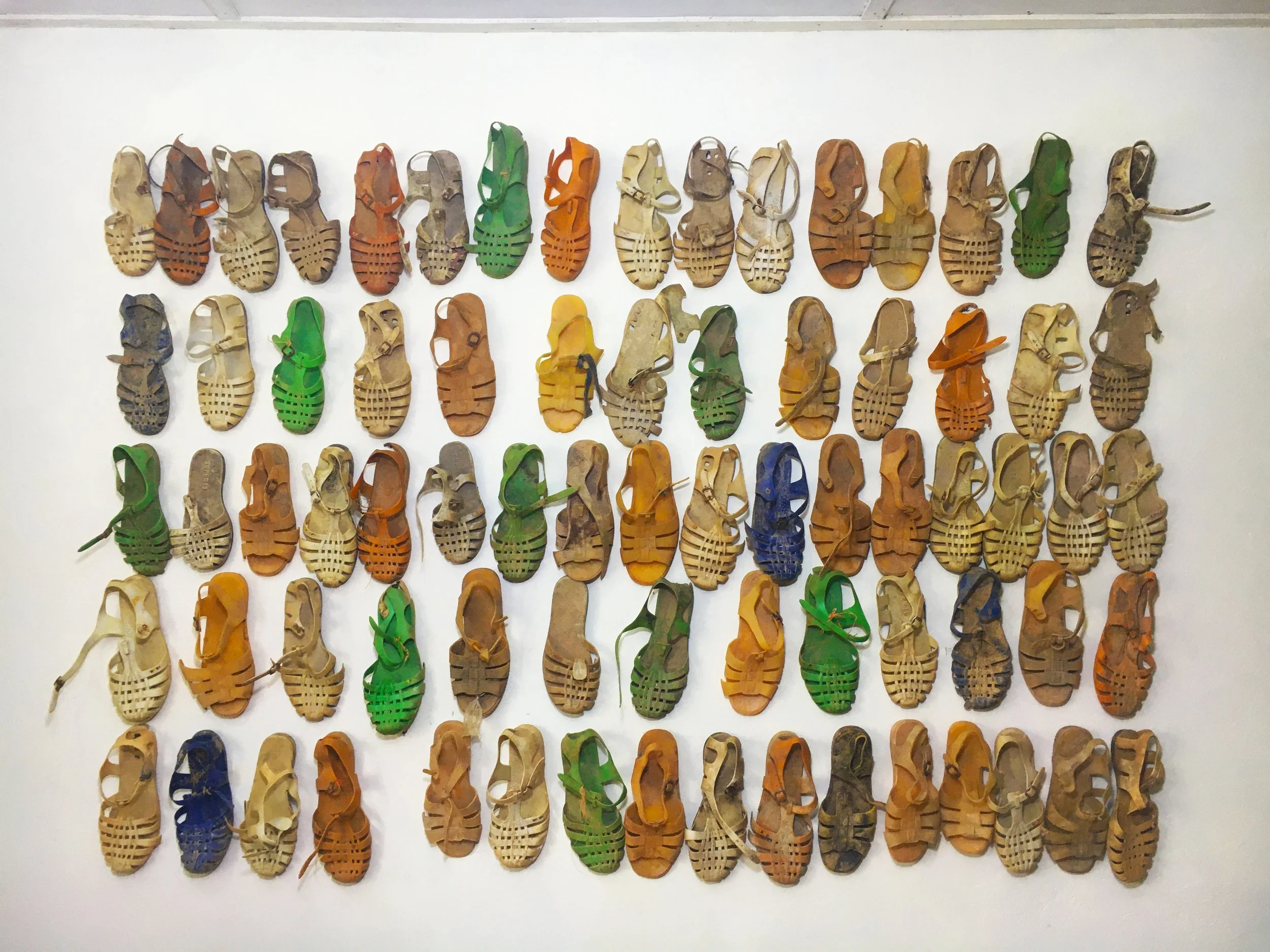 Memory traces I, 2022, Decommissioned ‘galamsey’ shoes, 6.5x4.7 feet.