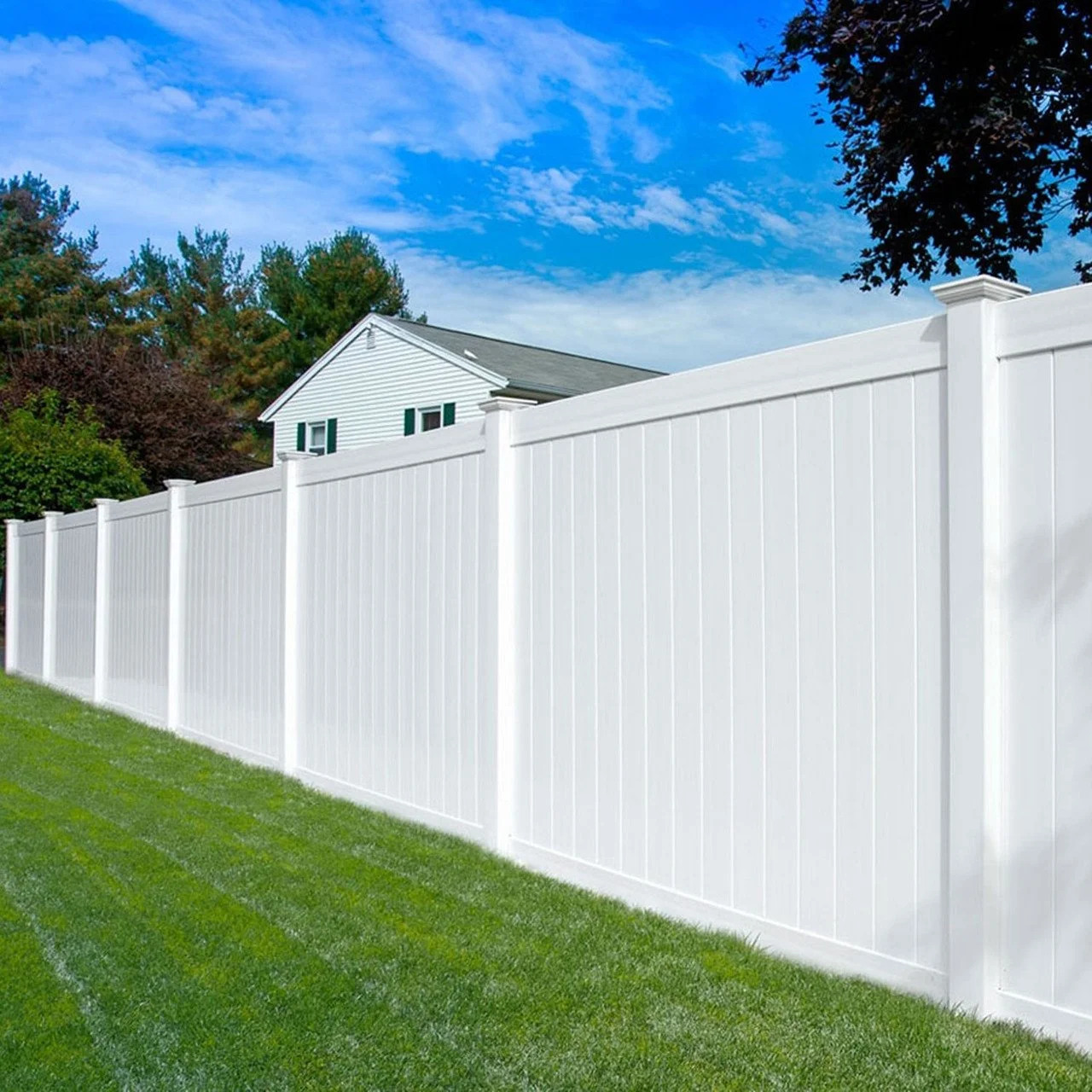 Open Middle Tennessee back yard with new turf behind a white vinyl fence