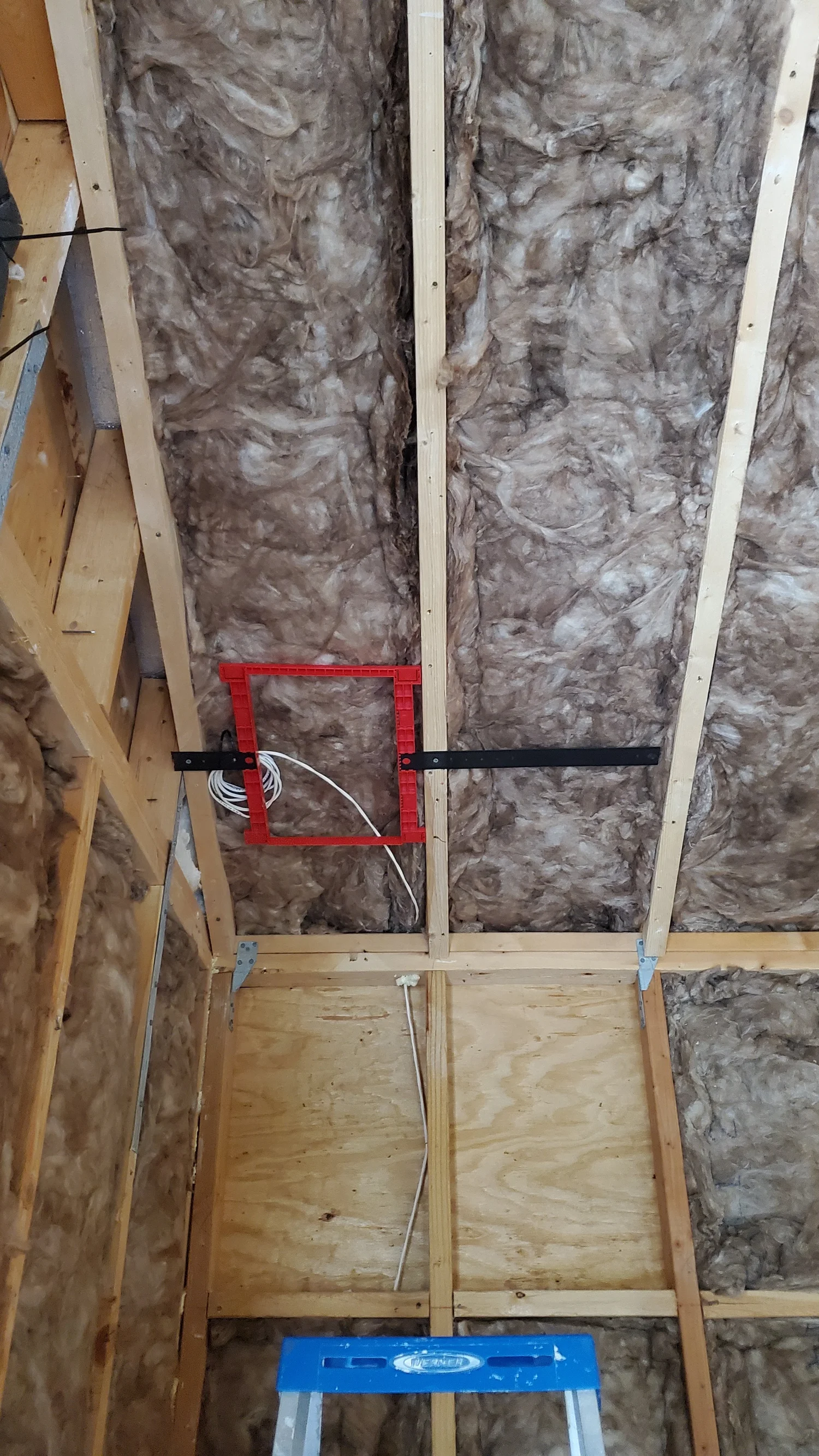Media room remodel prewire, low-voltage bracket and cable in an open wall