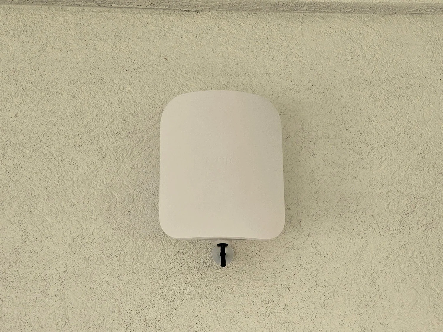 Outdoor Wi-Fi access point mounted on a home exterior