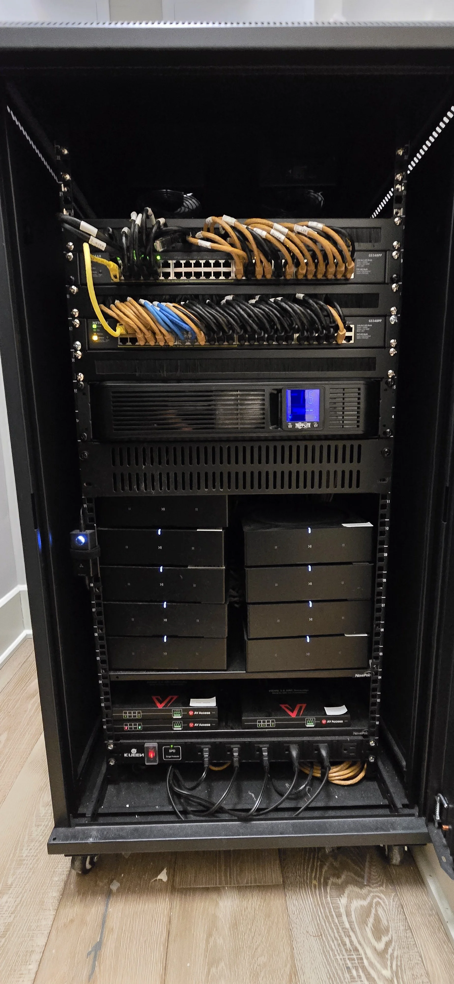 Organized network and audio equipment rack with power conditioning