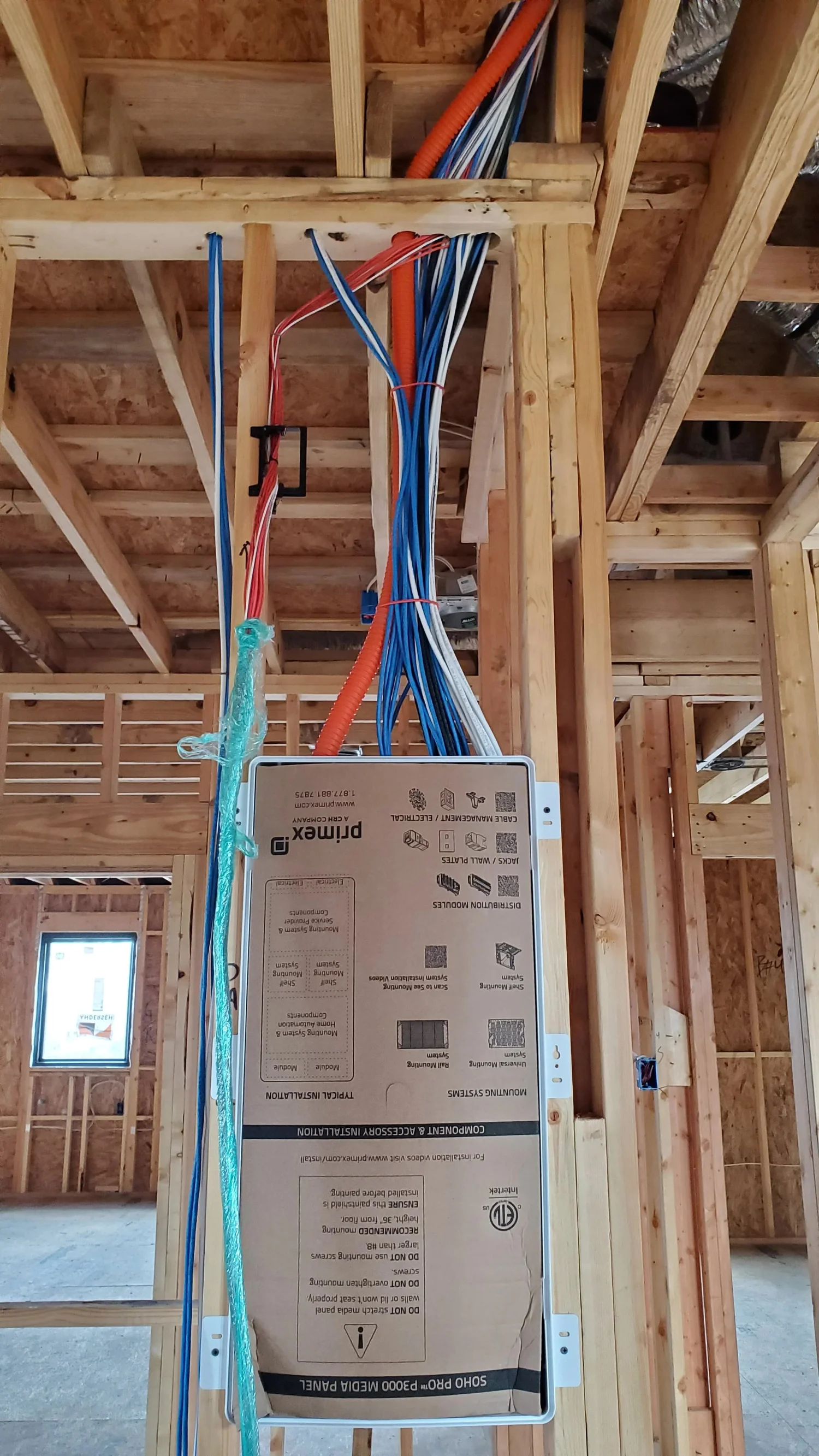 Structured wiring panel installed in framing during construction of a custom home