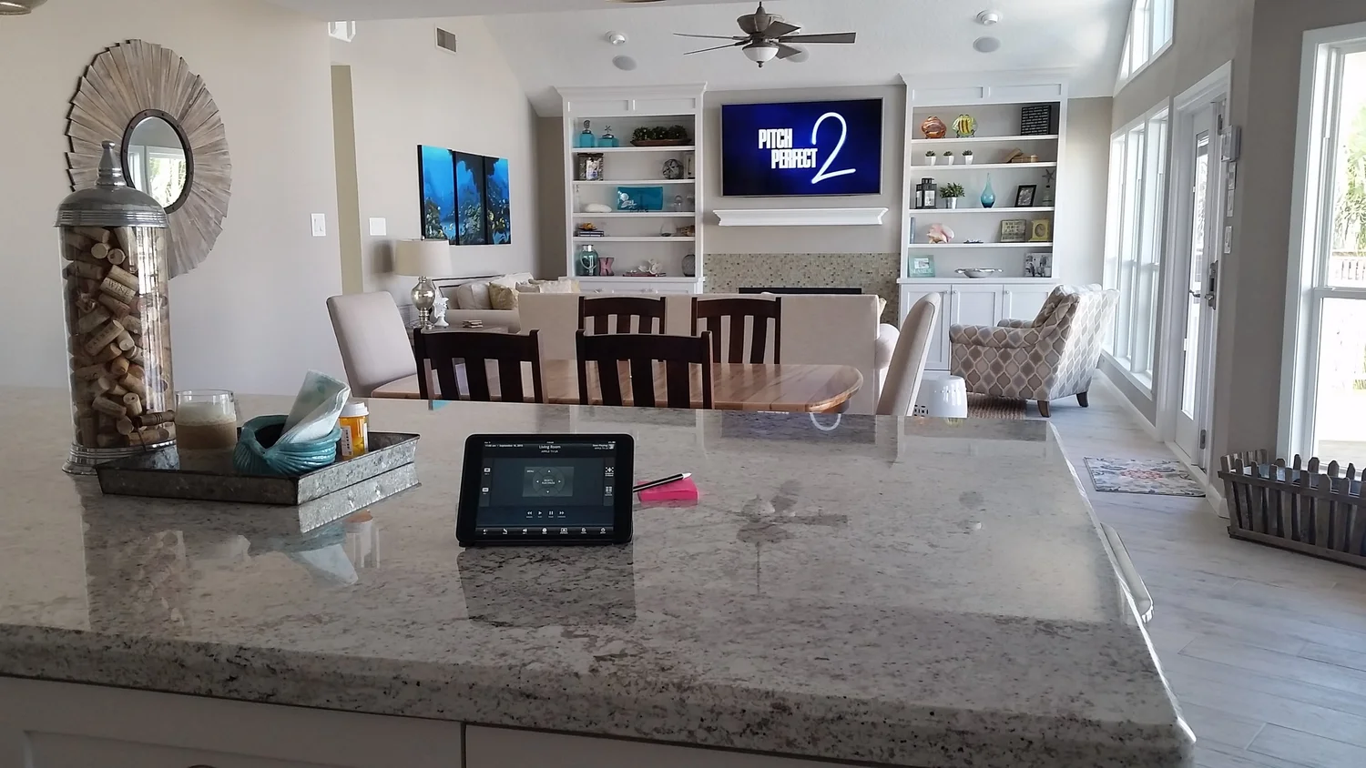 Kitchen island and wall-mounted control panel in a Houston home
